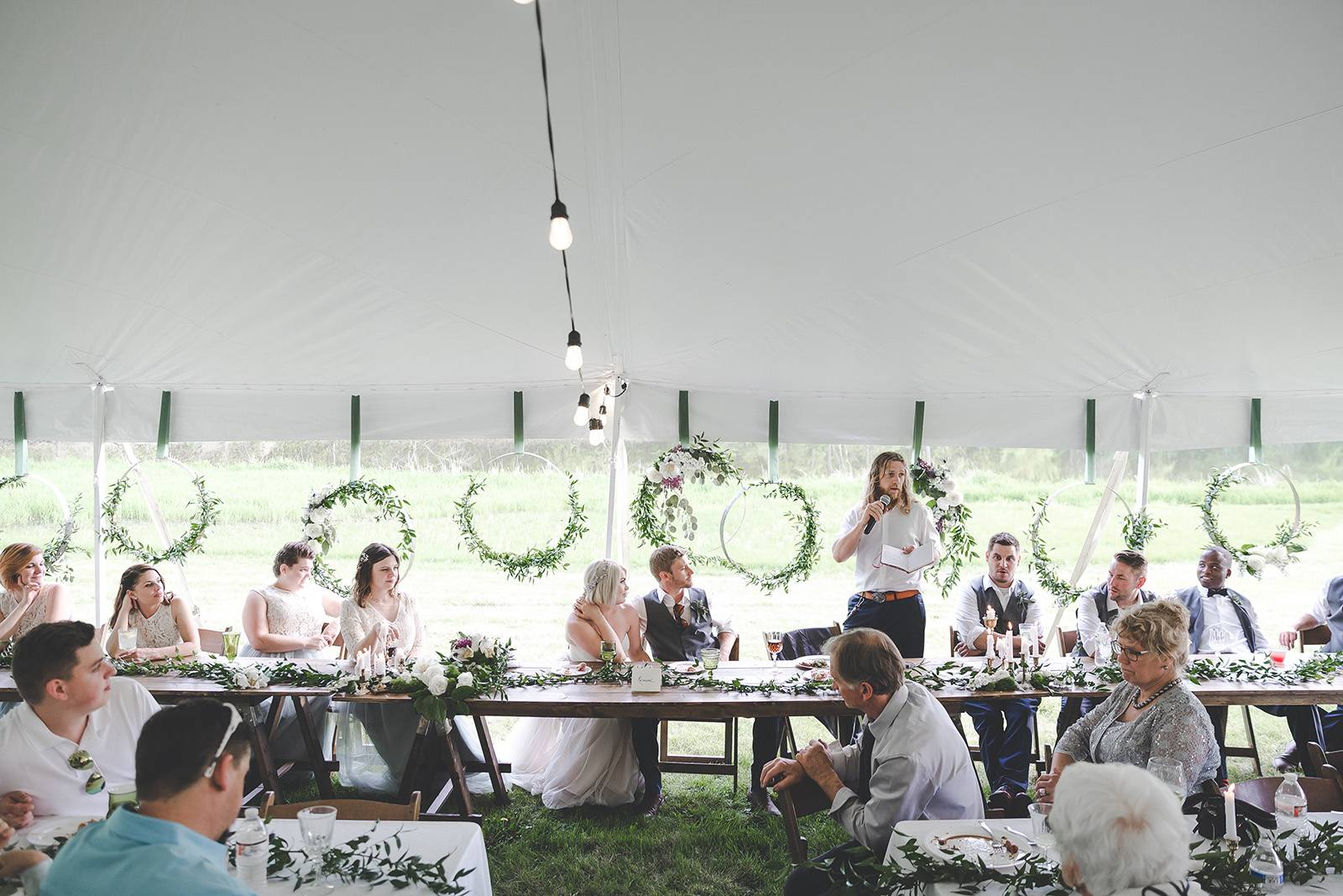 outdoor tent wedding decor, head table wood harvest tables