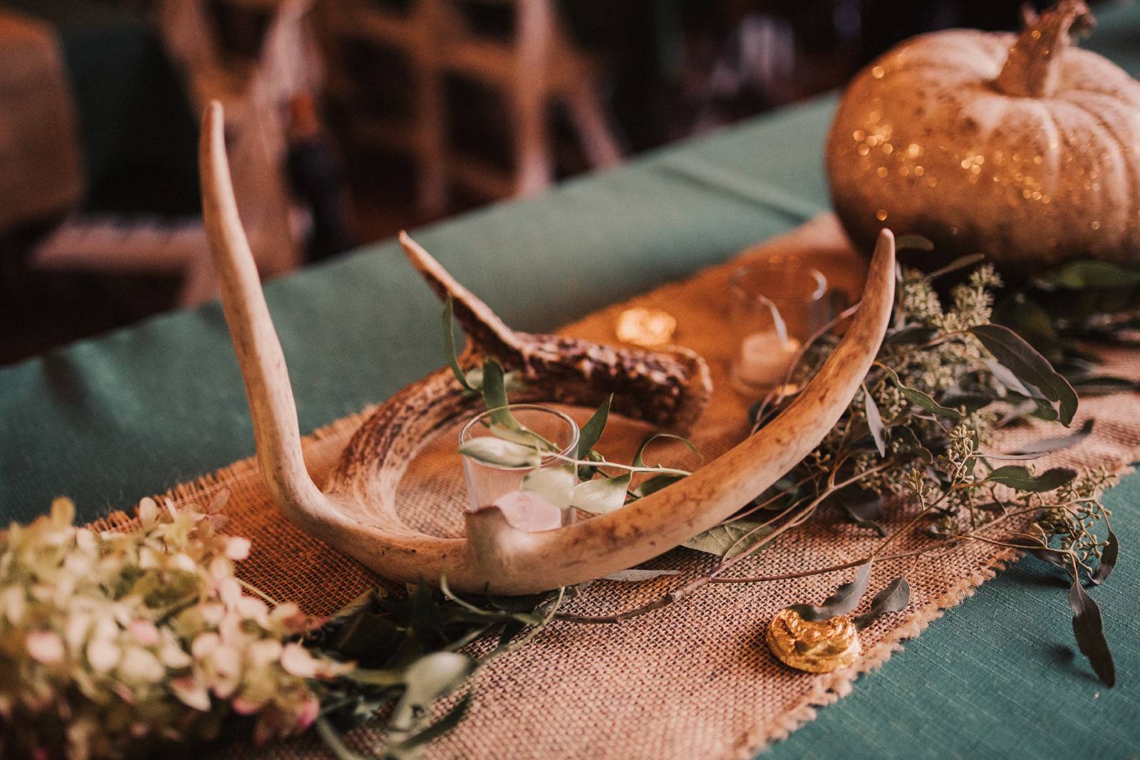 fall wedding, rustic barn wedding, deer antler decor, wedding greenery