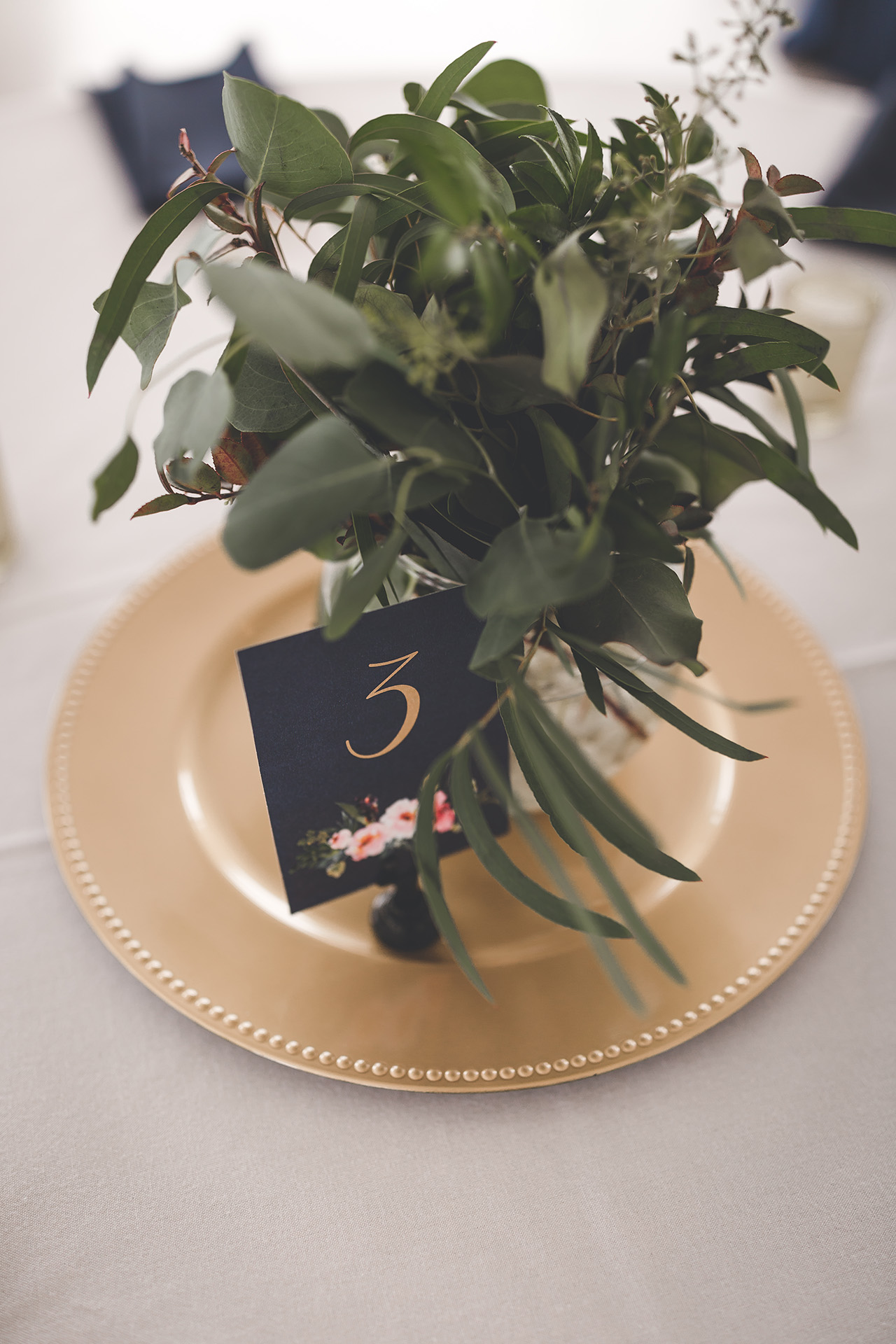 greenery centerpieces gold chargers