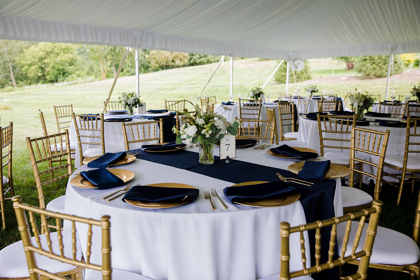 gold chiavari chairs, tent wedding, navy gold wedding, gold chargers