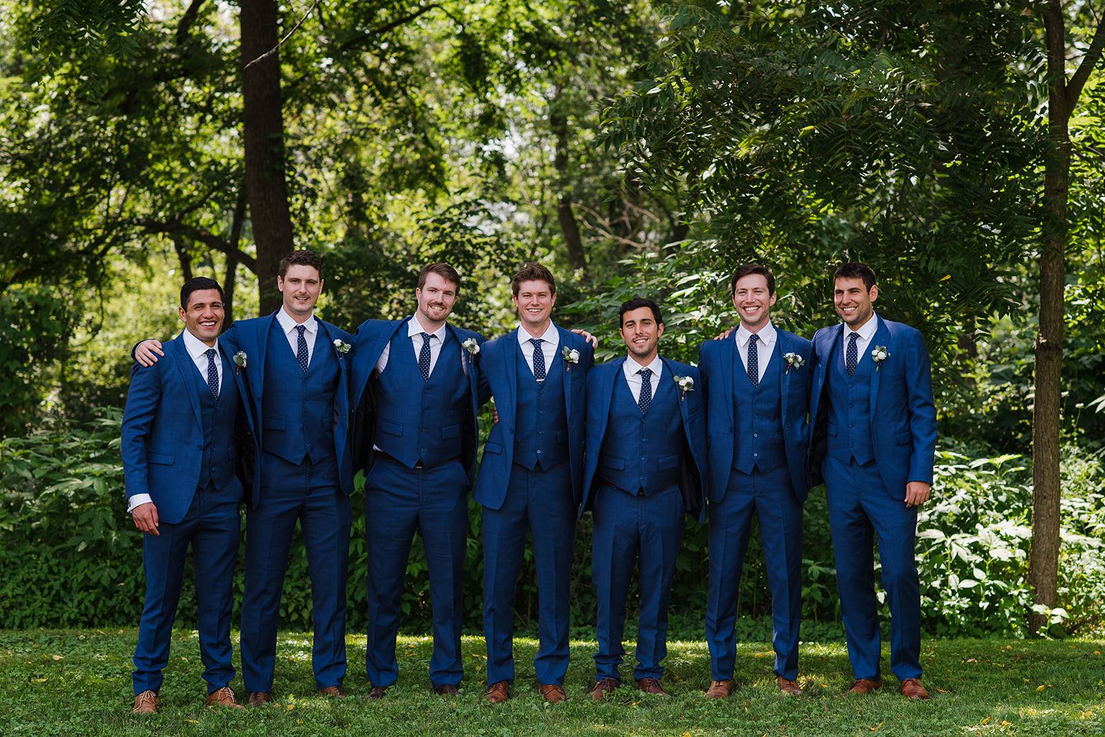 navy blue groomsmen tux suits