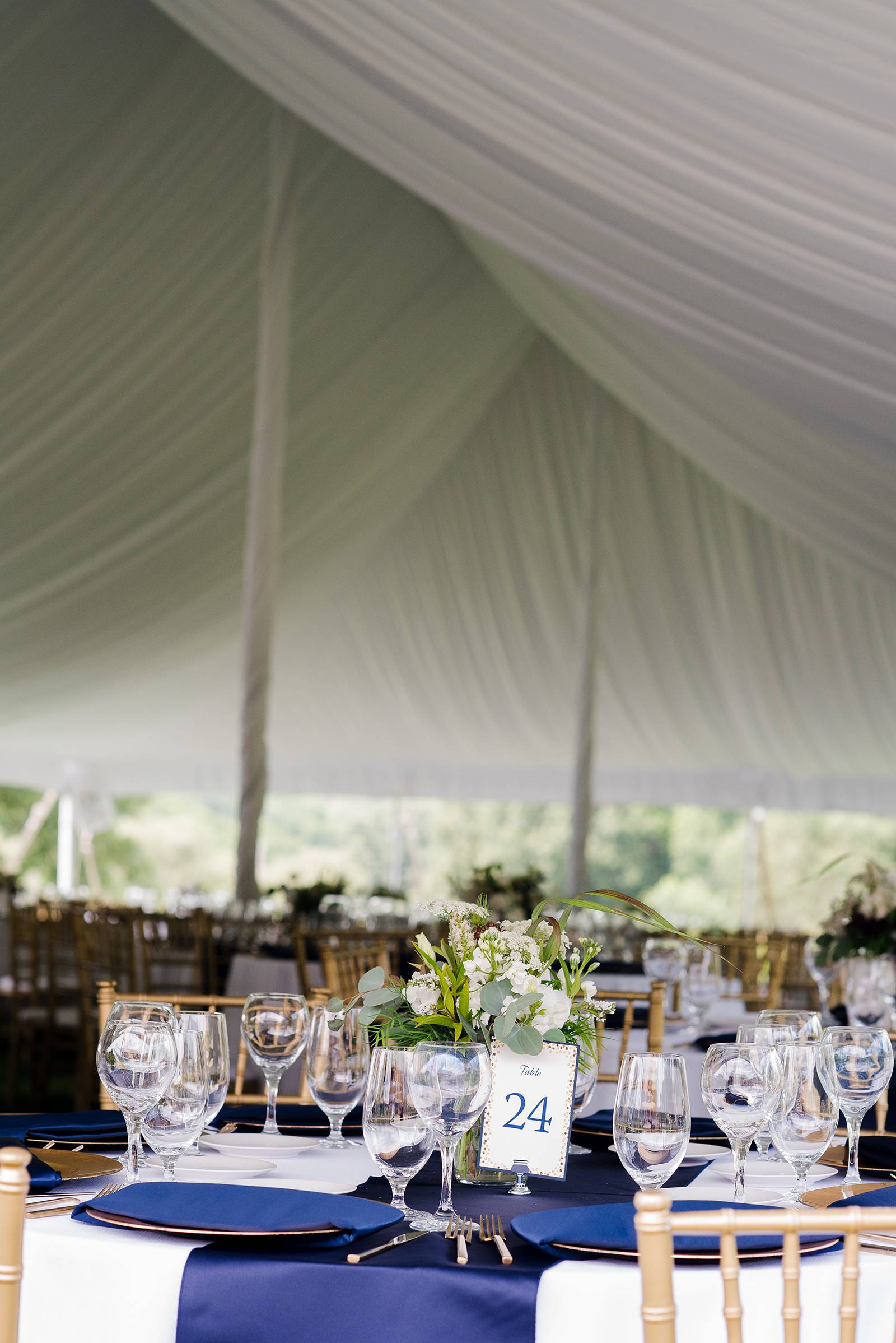 gold navy tent wedding reception decor