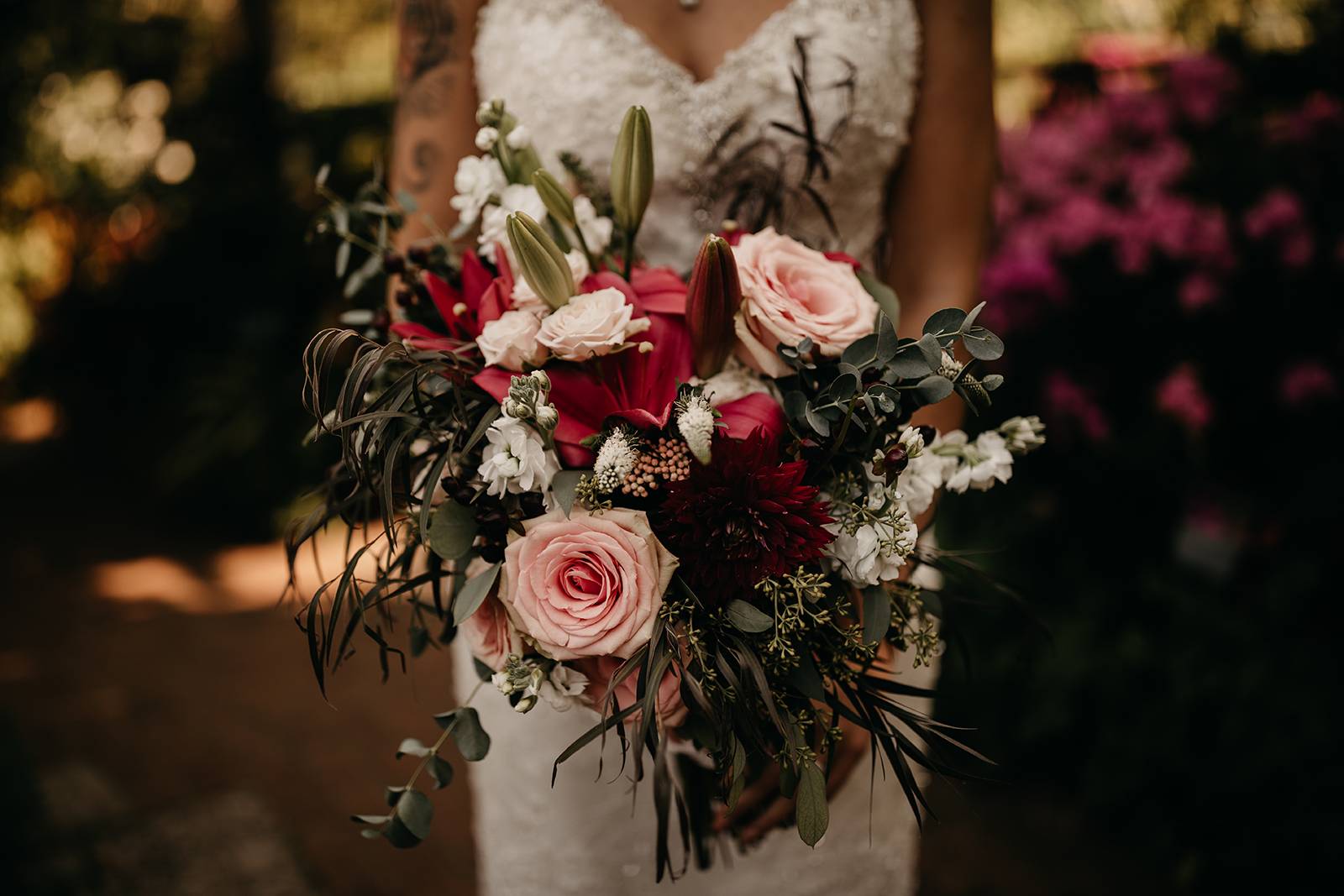 red lilies blush pink marsala maroon bridal wedding bouquet