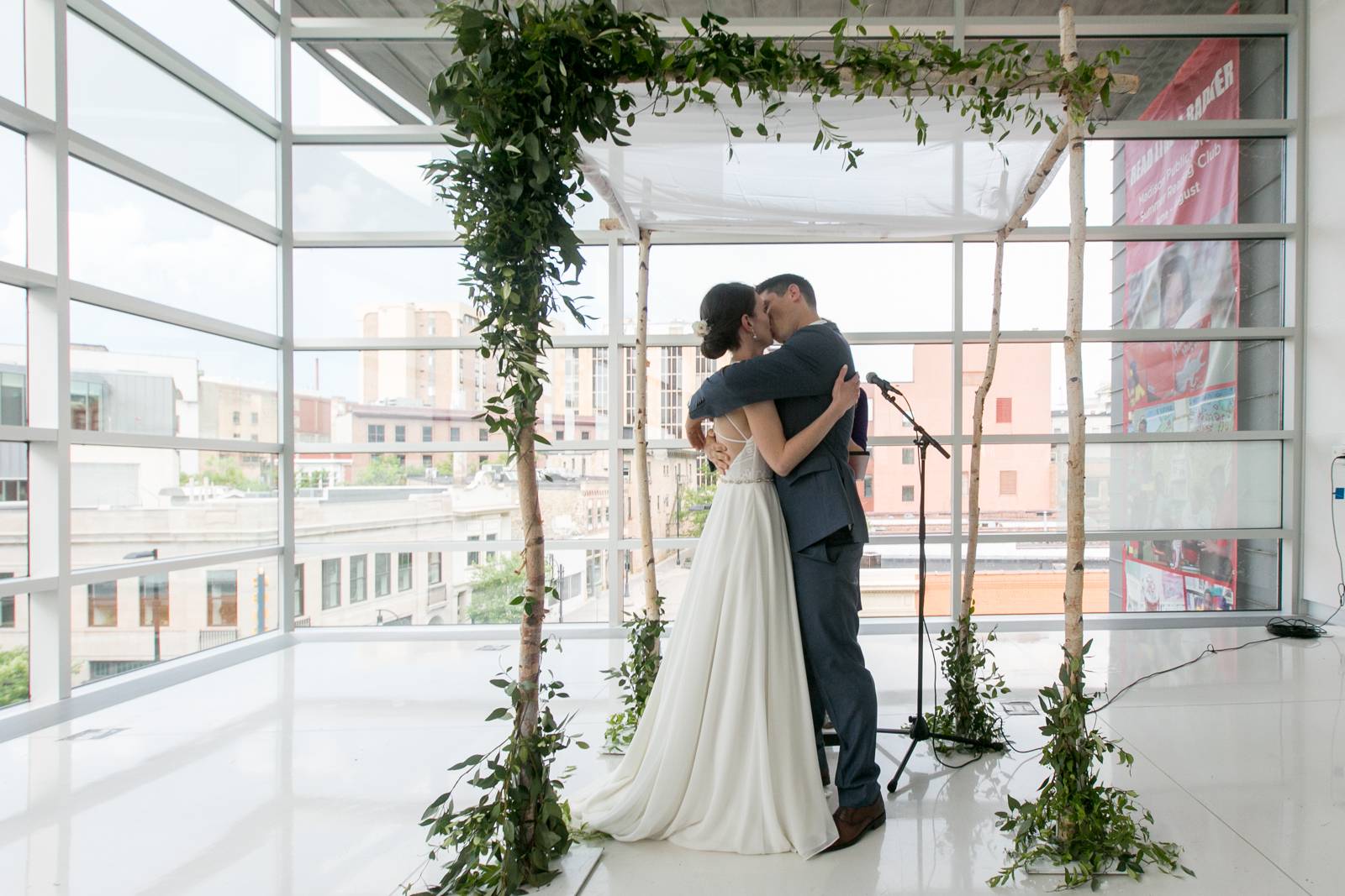 bride and groom under altar