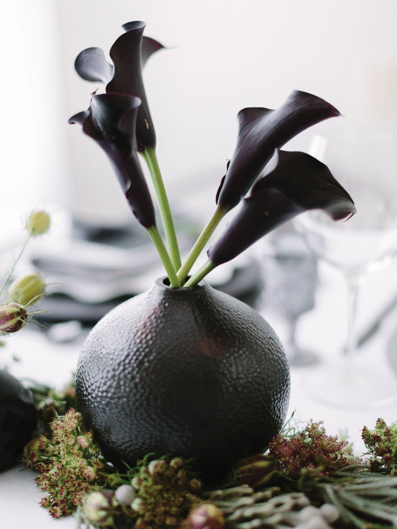 modern black vase with black calla lily bouquet
