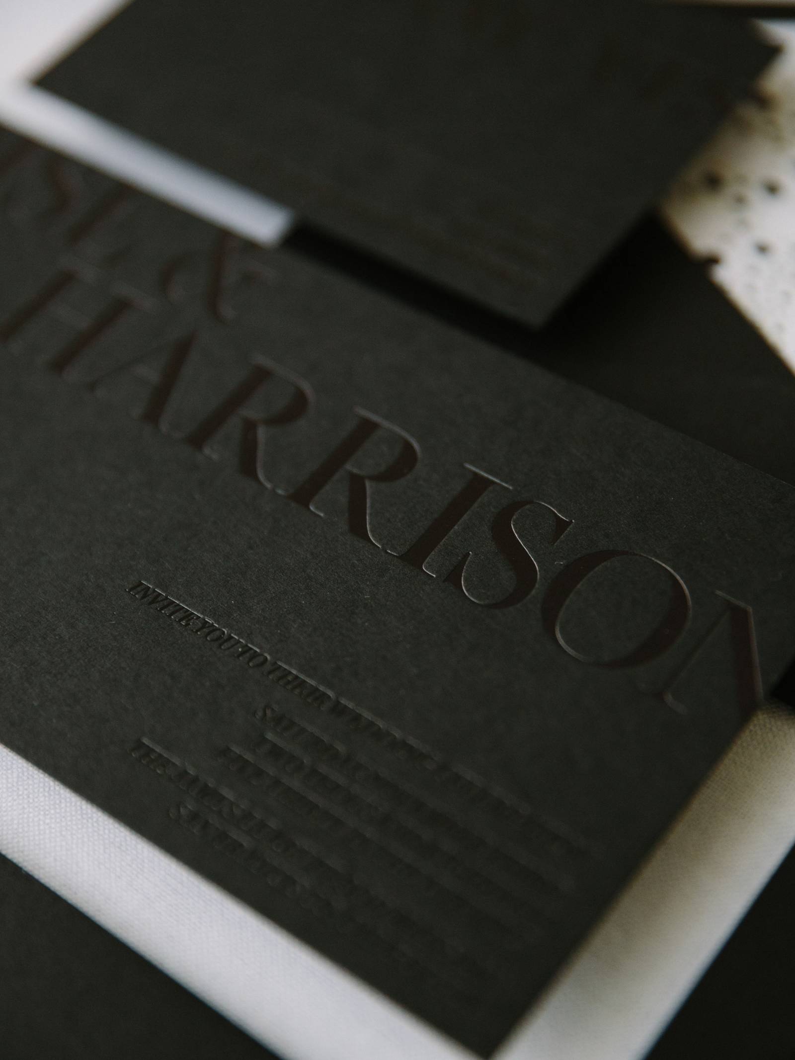 Black place card with letterpress guest name