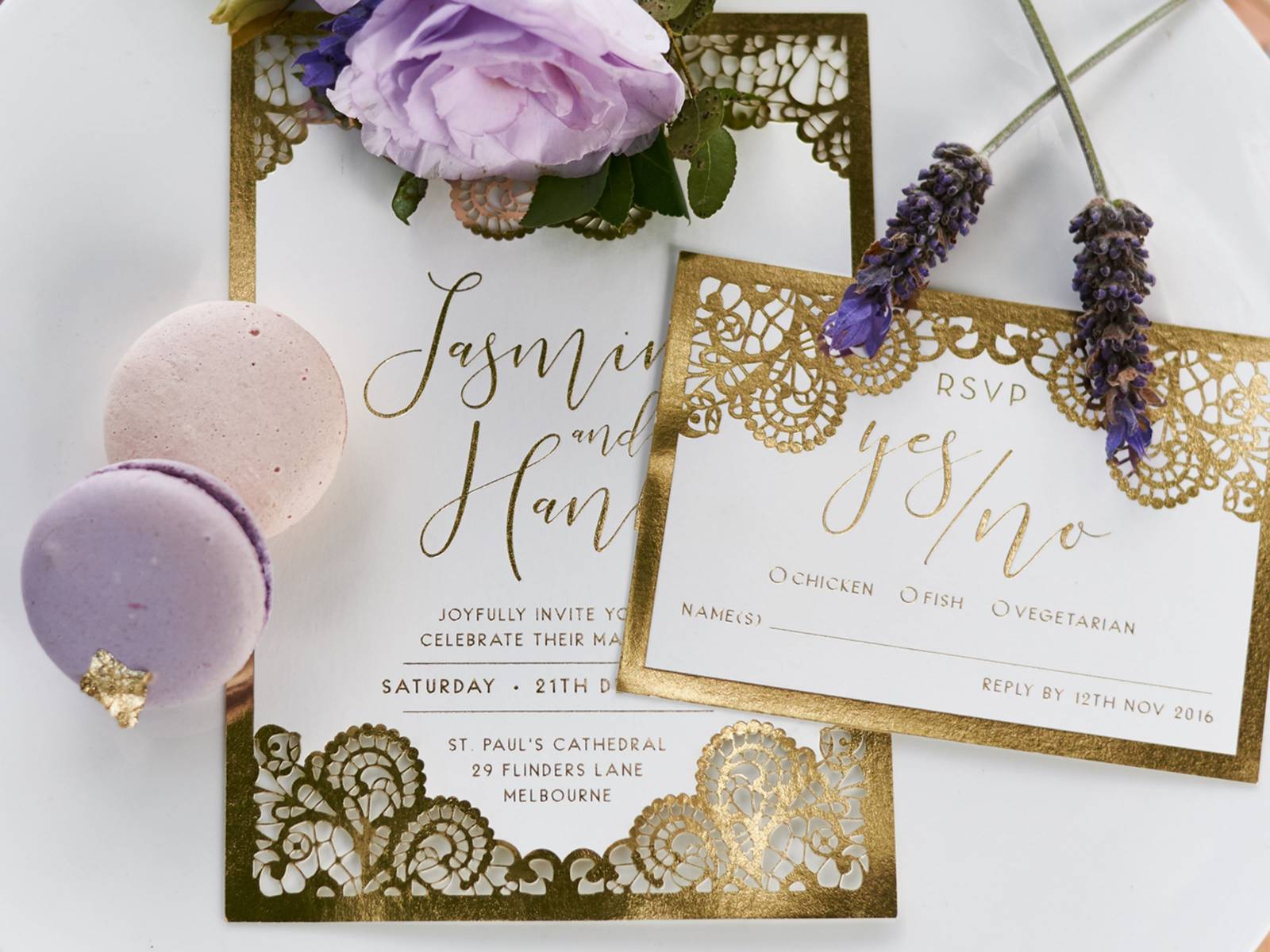 Elegant gold and white wedding invitation and RSVP card, bordered by fresh lavender and macaroons