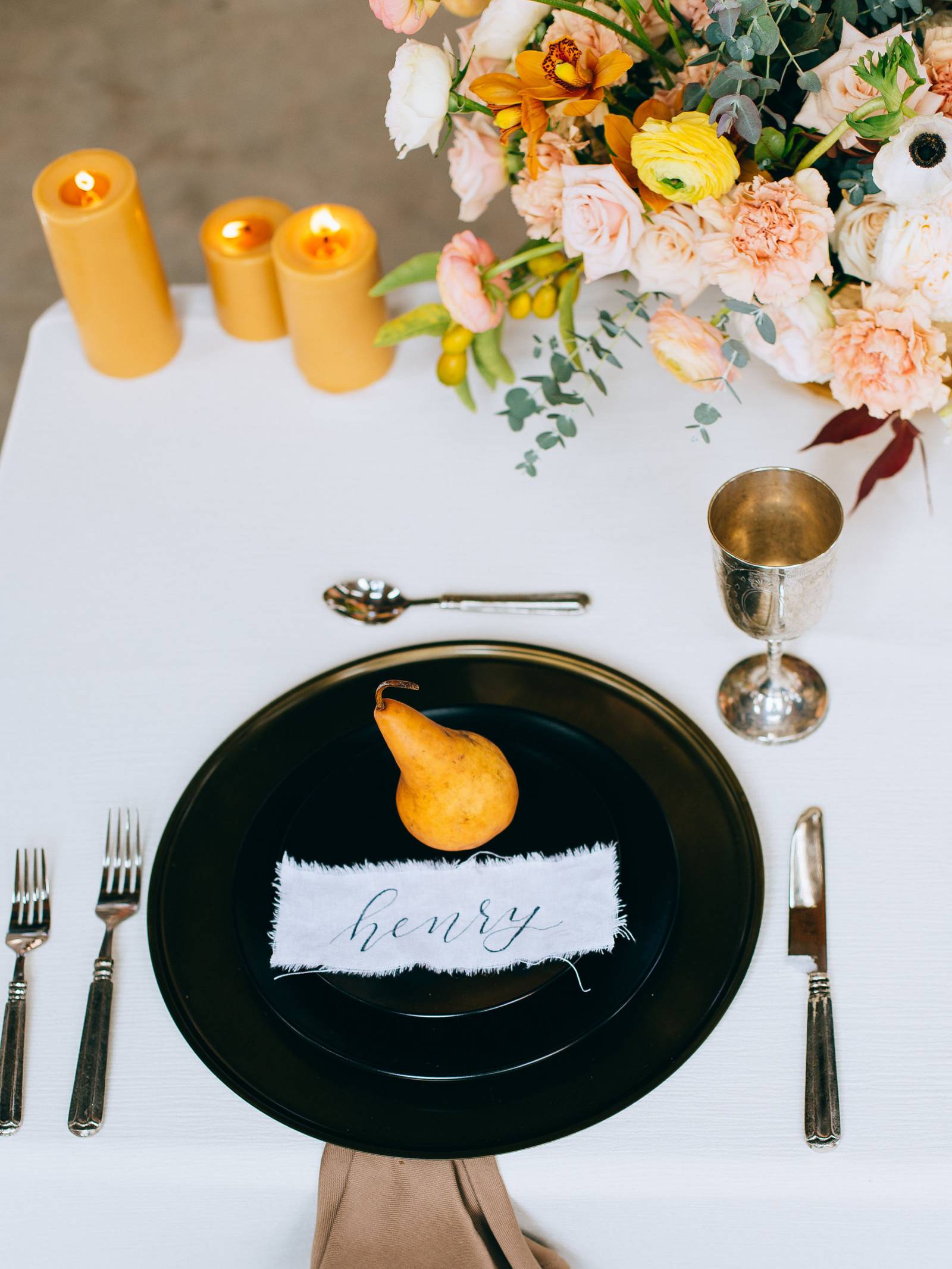 Yellow pair on a black plate with white fabric name card
