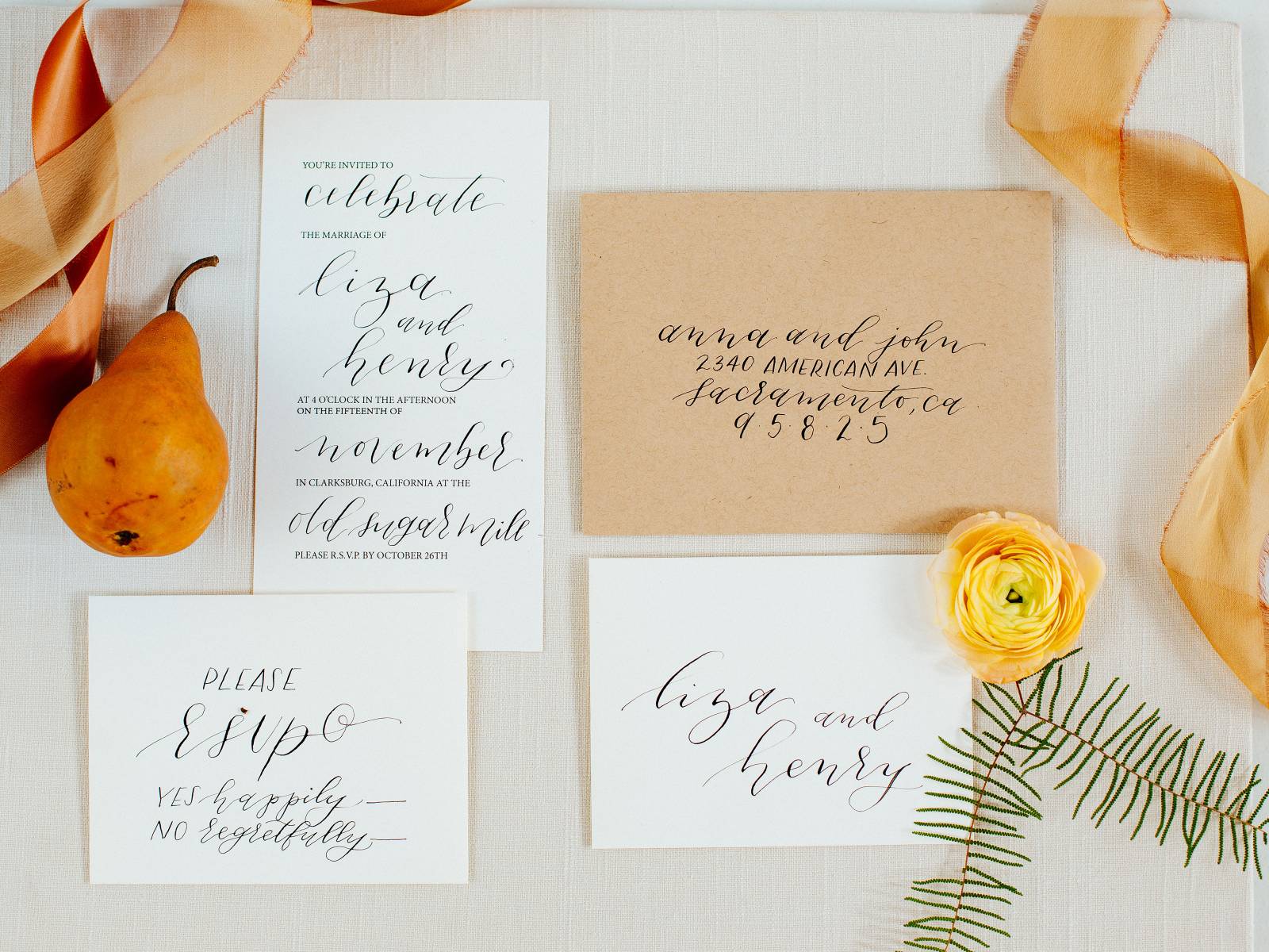 White wedding stationery and tan envelope