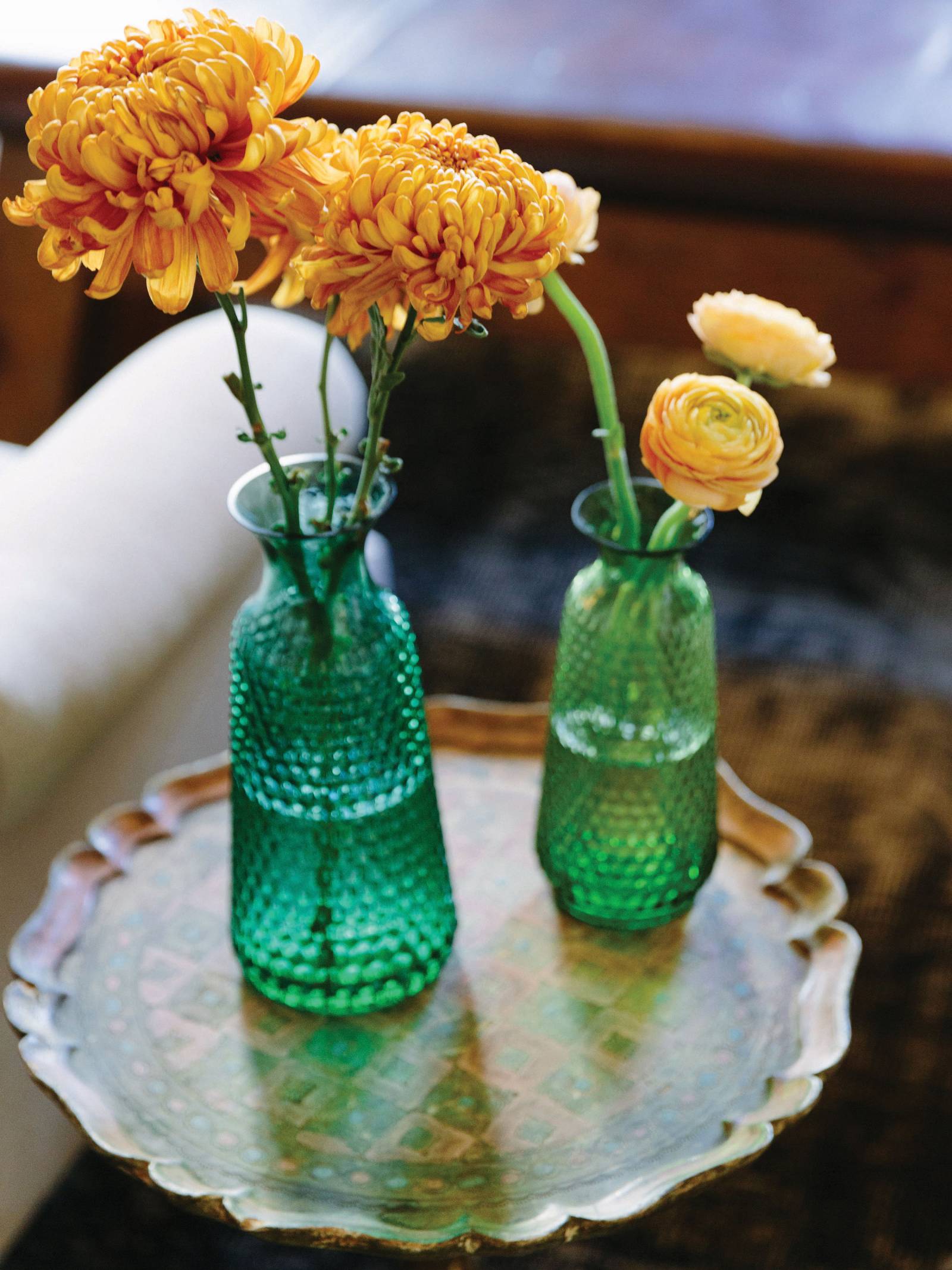 Vintage emerald green vases with orange and yellow flowers