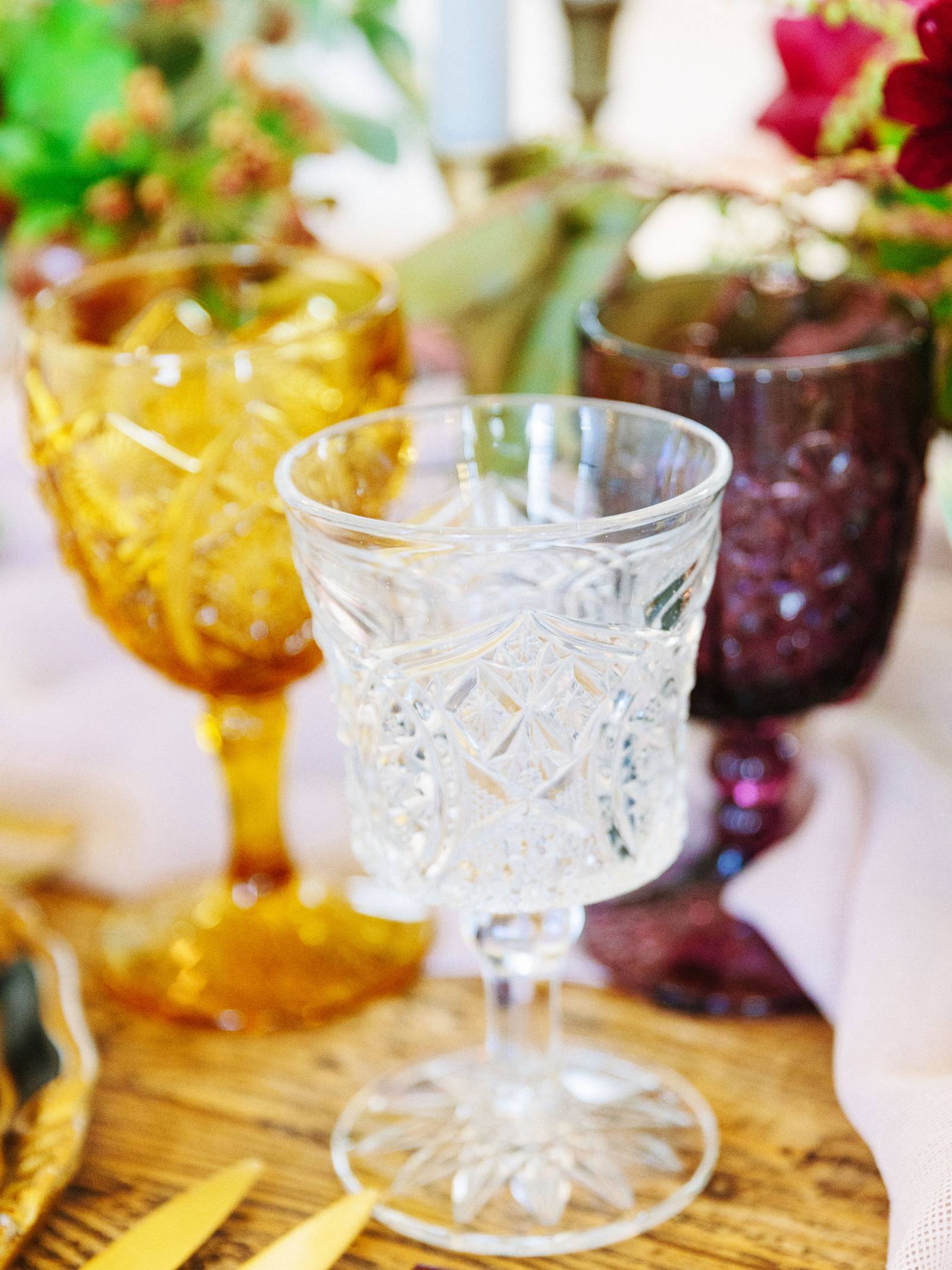 vintage cut-glass goblets in gold, purple and clear