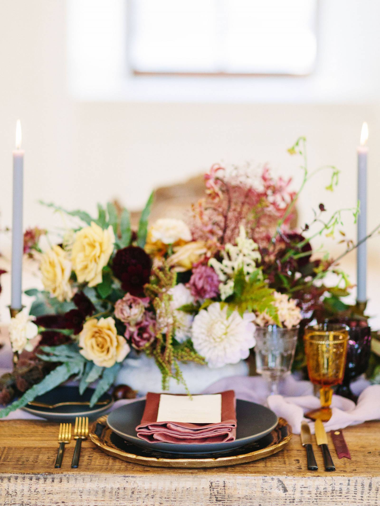 Multi-colored centerpiece of yellow, mauve and white.