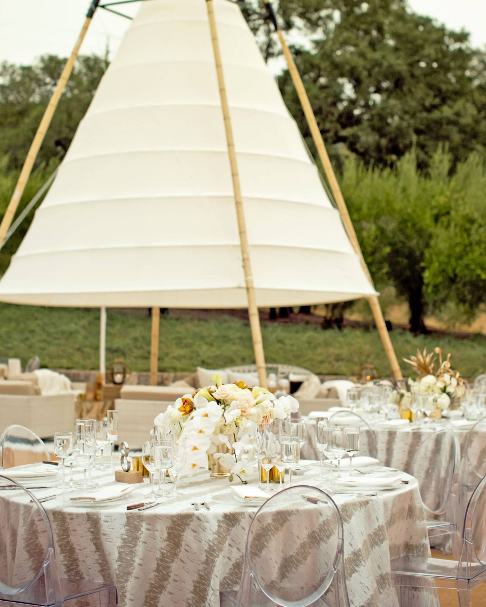 white canvas tepee and reception tables
