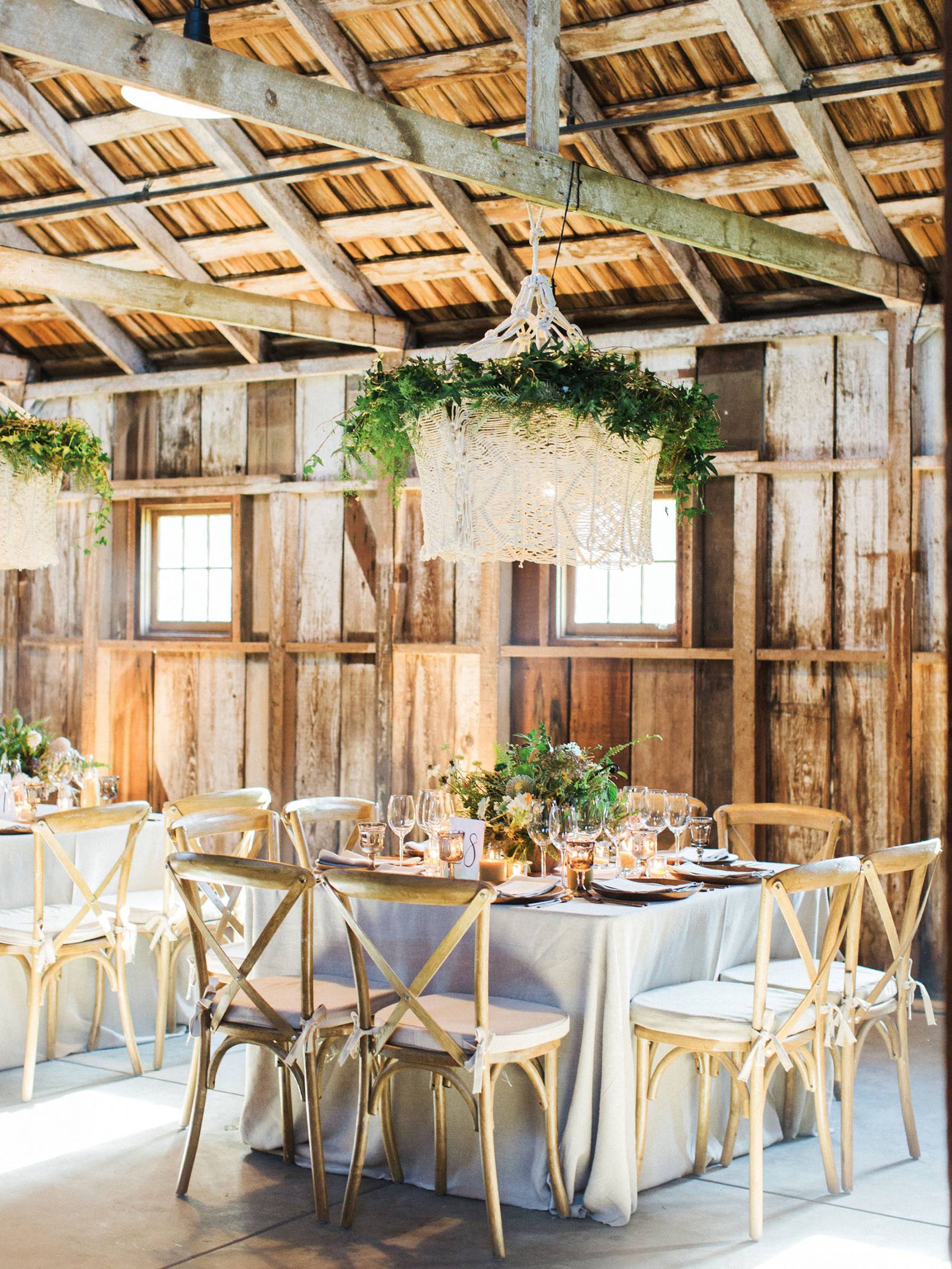 square reception table setting with macrame chandelier