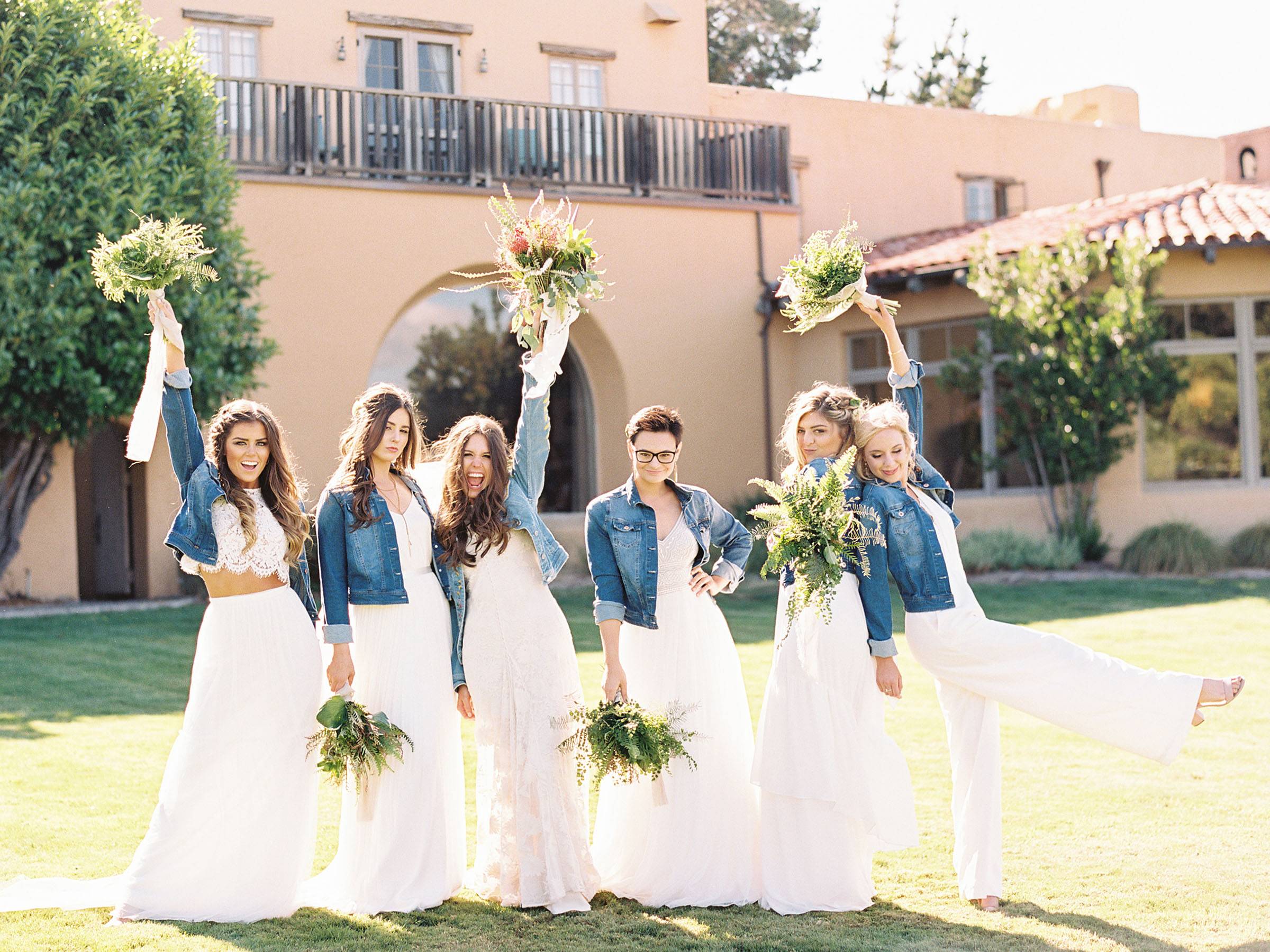 bridesmaids in white dresses and denim jackets