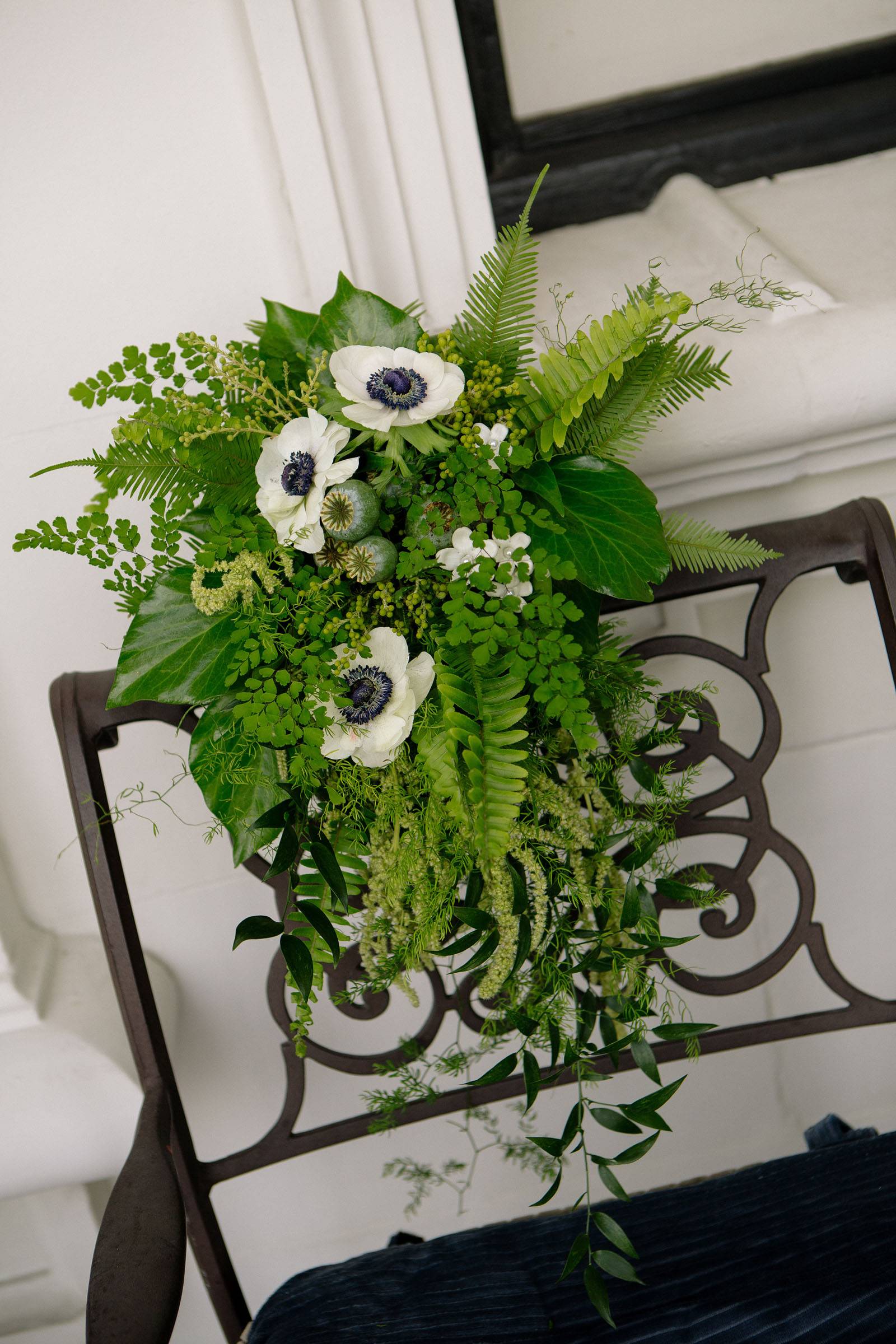 lush green bridal bouquet of ferns, greenery and anemones