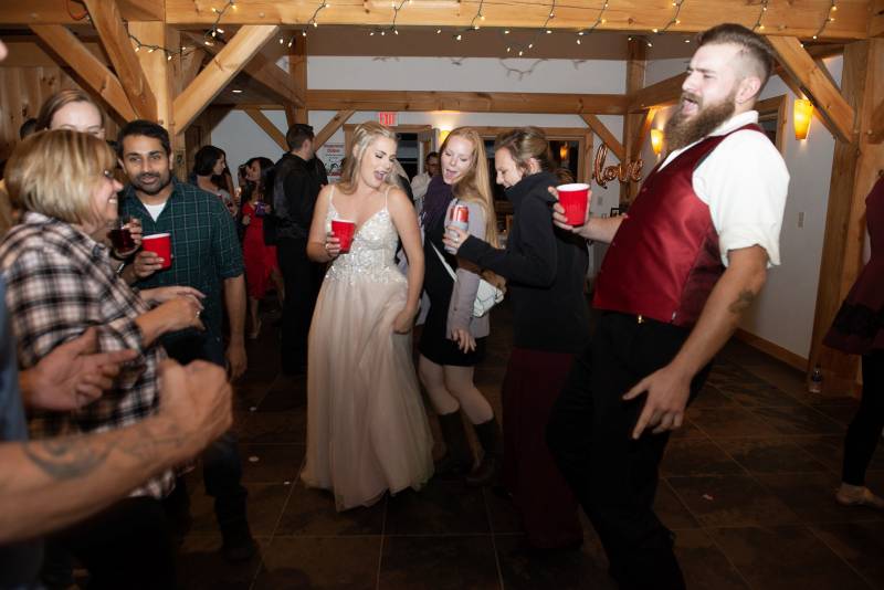 Dancing at indoor reception at Sharp Farm Milton Vermont wedding venue