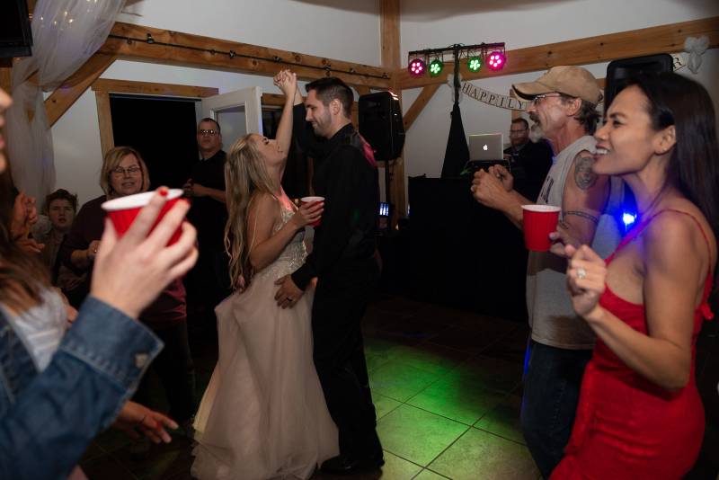 Dancing at indoor reception at Sharp Farm Milton Vermont wedding venue