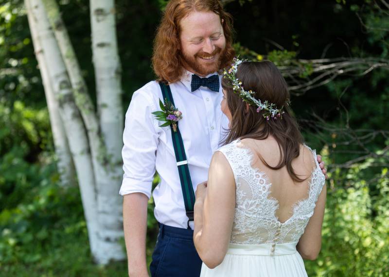 first look of bride and groom at bohemian woodsy wedding