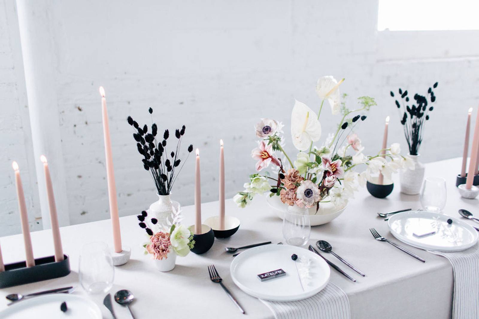 Modern romantic table setting for loft wedding