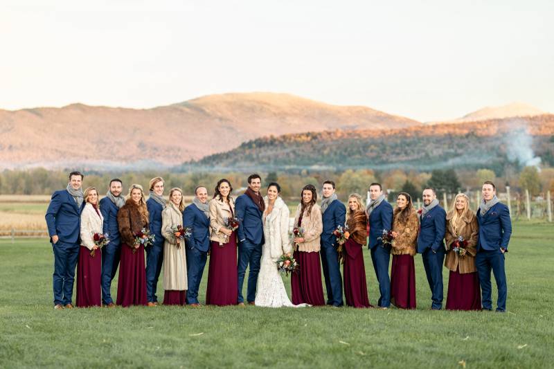 Wedding party for fall wedding at Boyden Barn with bridesmaids in wine dresses and men in blue suits