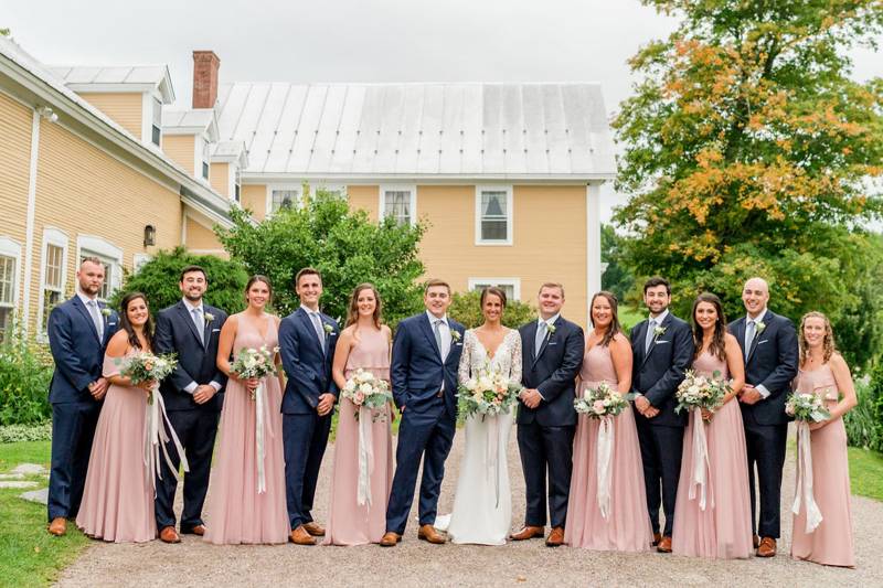 Groomsmen in navy and bridesmaids in blush on wedding day at the Inn at the Round Barn Farm
