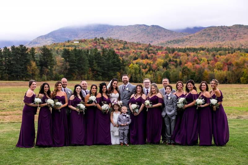Wedding party photo with mountain backdrop at the Barn at Smuggler's Notch in Vermont during fall we