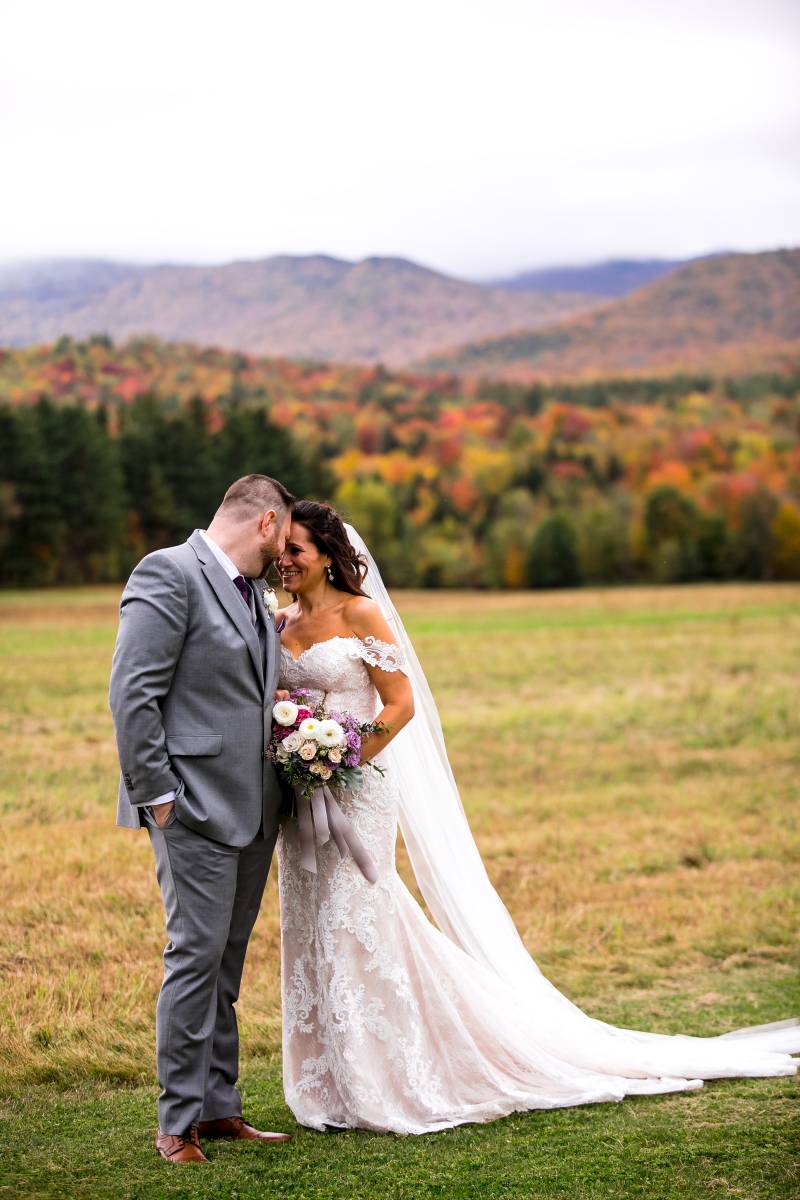 Wedding portrait of couple during peak foliage at fall wedding at the Barn at Smuggler's Notch in Ve