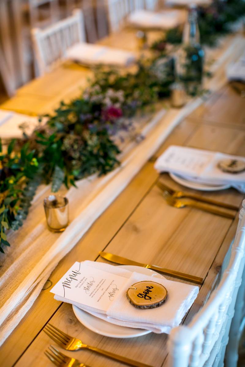 Wood disk place cards at fall boho rustic wedding at Smuggler's Notch in Vermont