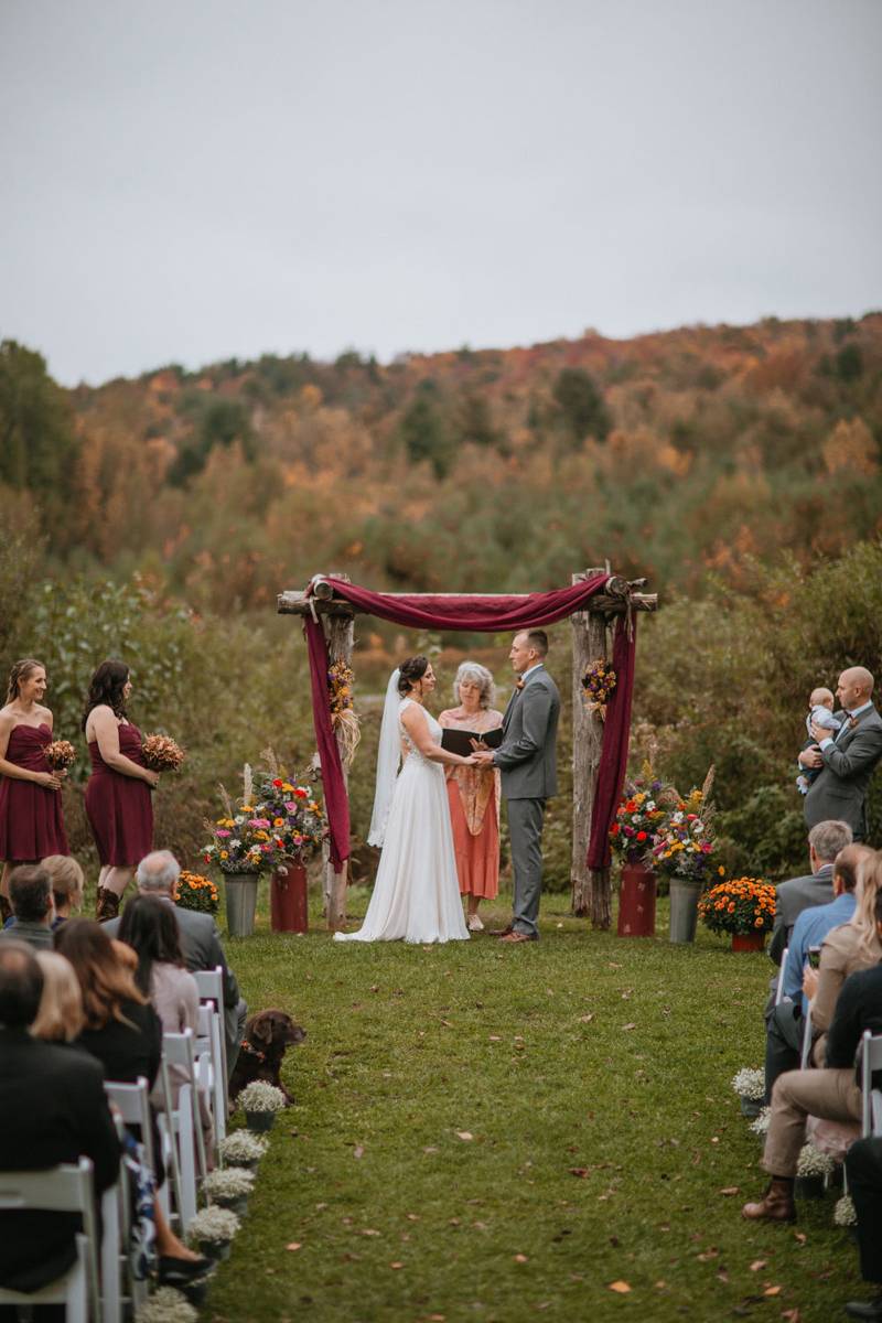 Outdoor ceremony archway decor for fall wedding at the Mansfield Barn in Jericho Vermont