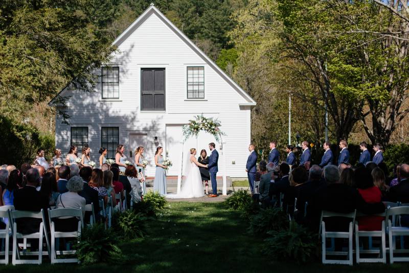 Outdoor wedding ceremony at the Woodstock Inn in Vermont during spring wedding