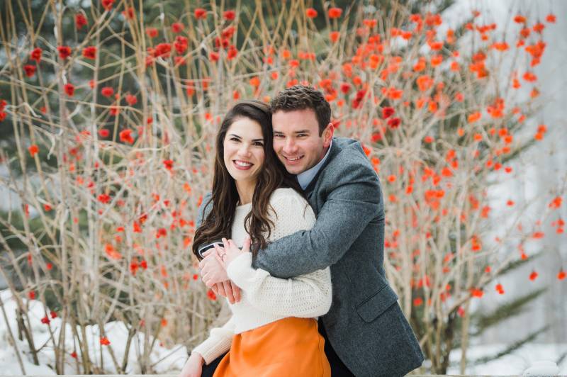 Winter Vermont engagement photo session featuring late fall blooms and warm colors