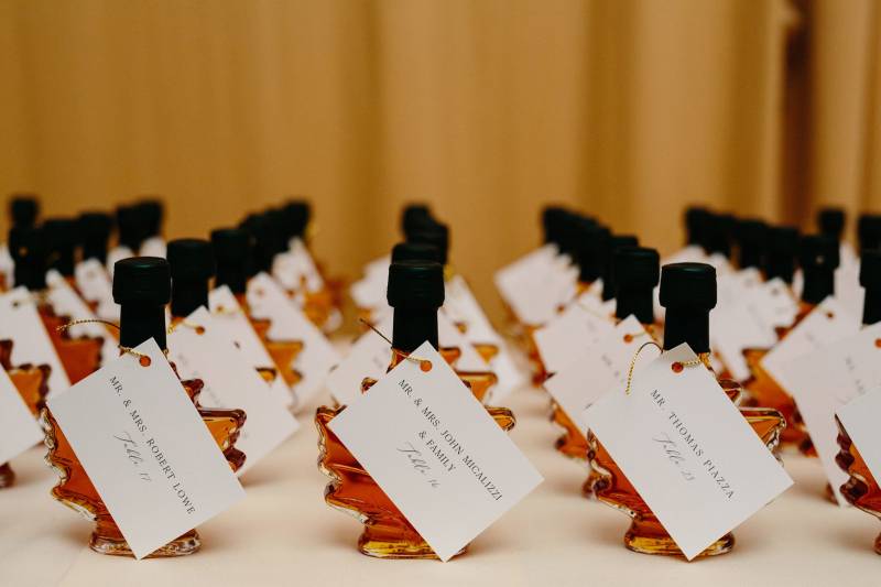 Maple syrup favor seating chart during fall Vermont destination wedding