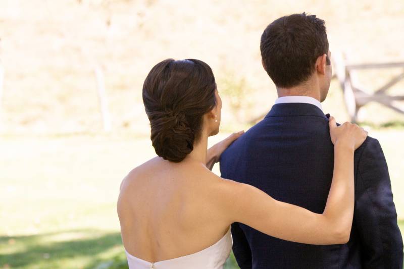 Classic chignon updo and strapless wedding gown for romantic fall wedding
