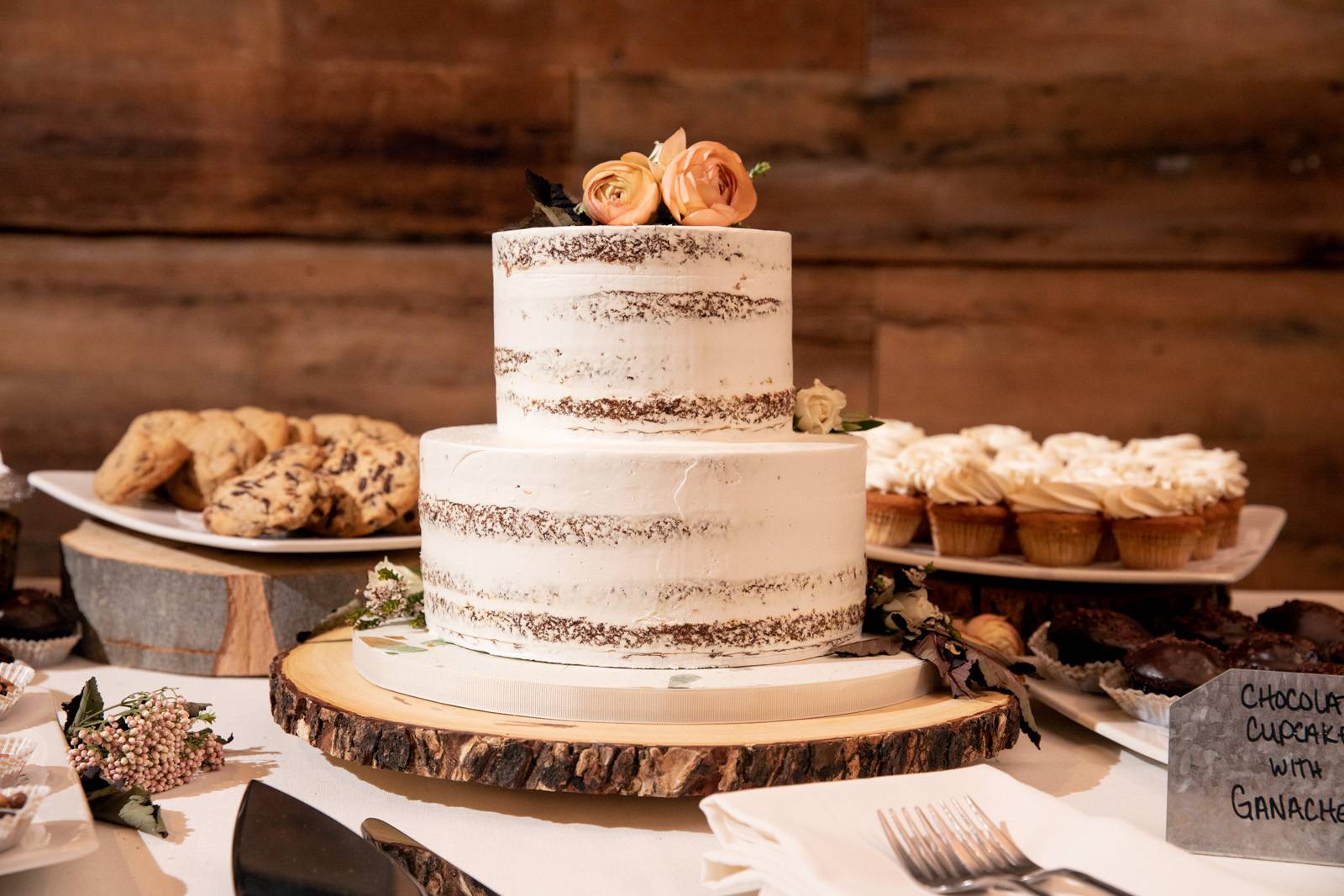 Naked wedding cake with blush flowers for fall wedding at the Inn at the Round Barn Farm