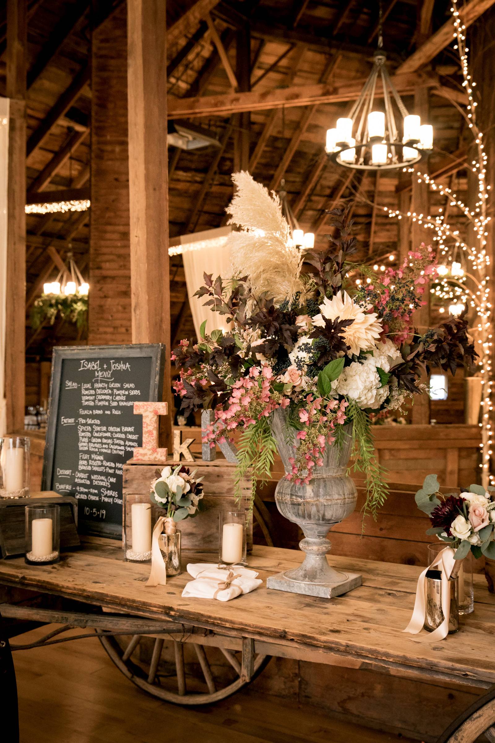 Welcome table set for a romantic fall wedding at the Inn at the Round Barn Farm