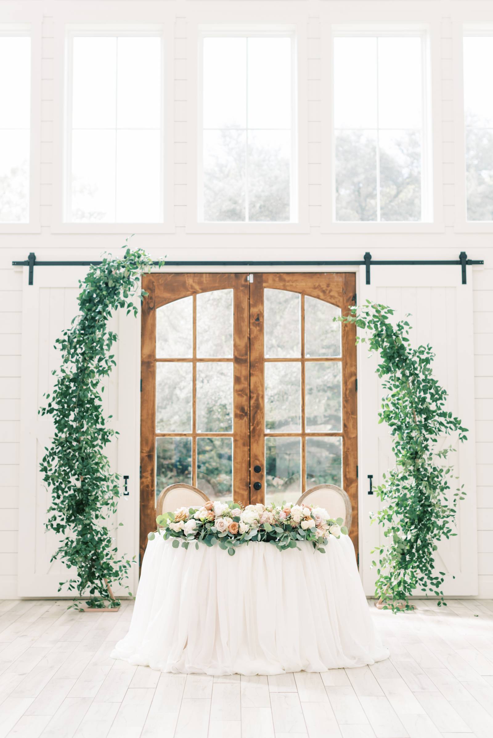Sweetheart table with greenery