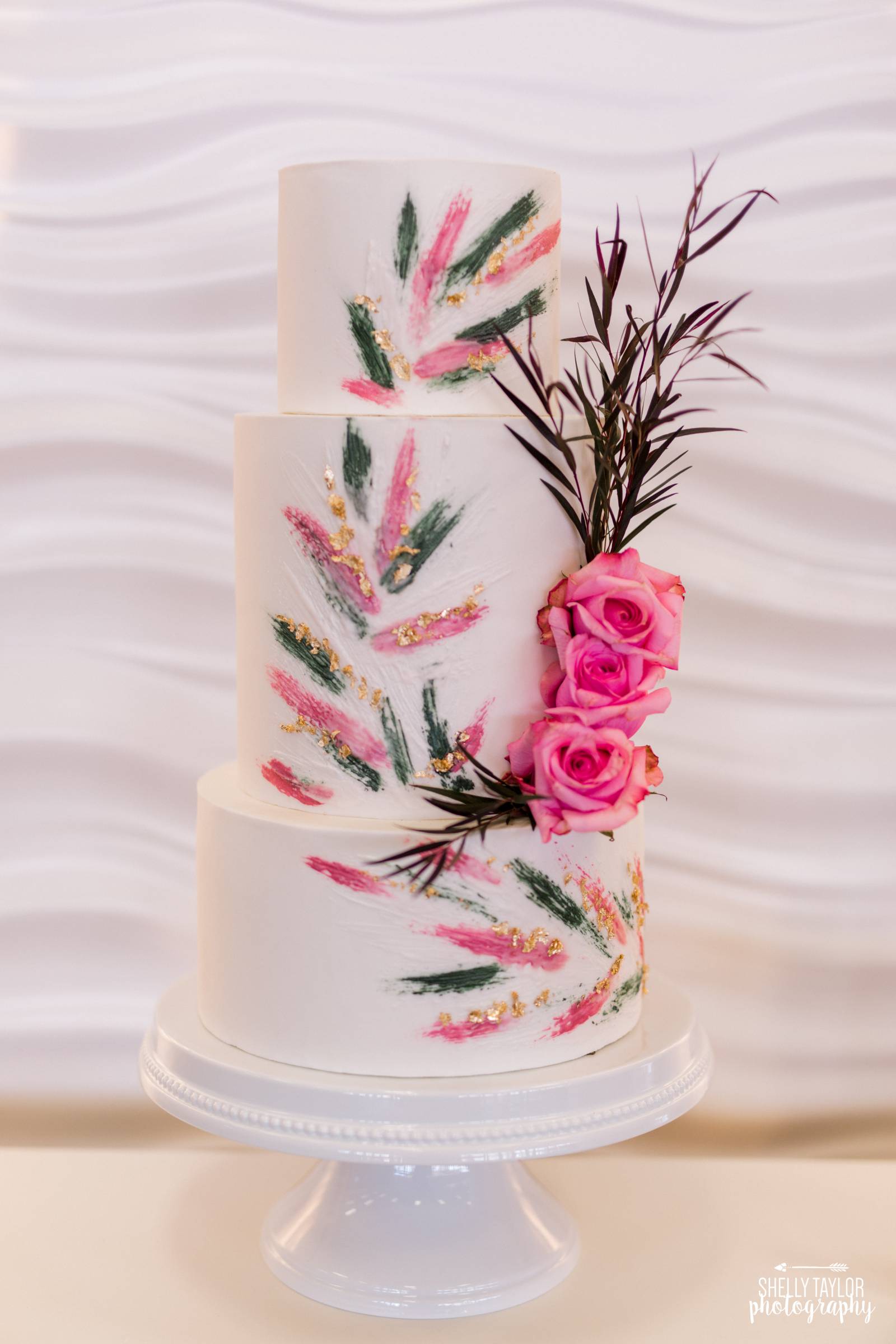 3 tier white cake with pink and green details