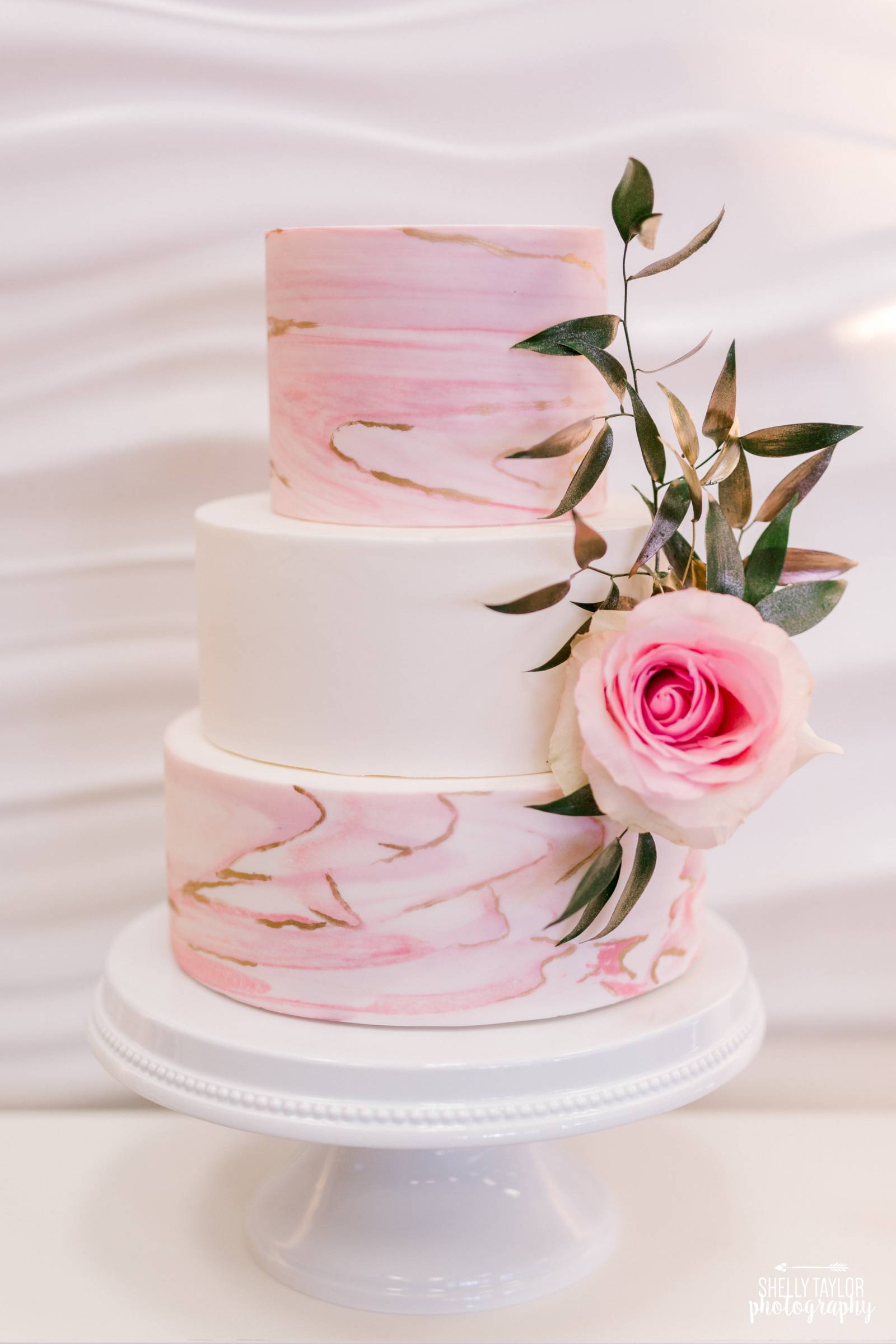 3 tier pink and white cake