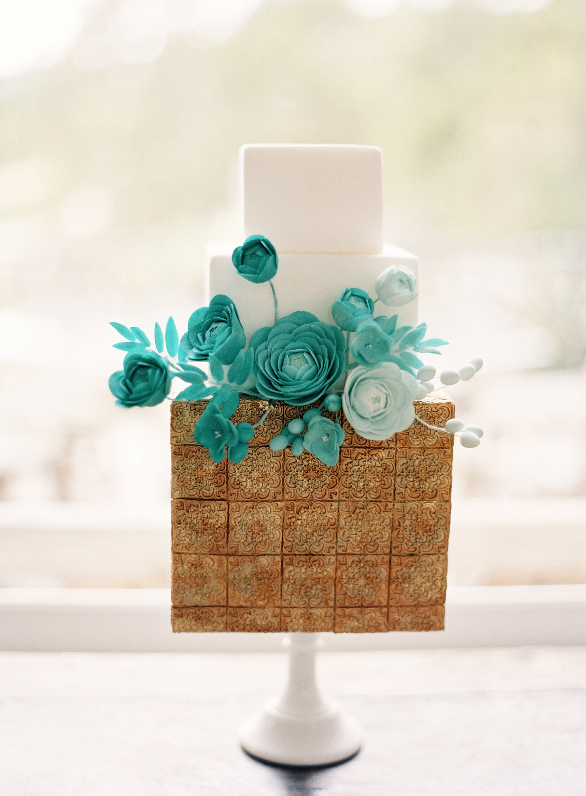 Turquoise and gold floral wedding cake
