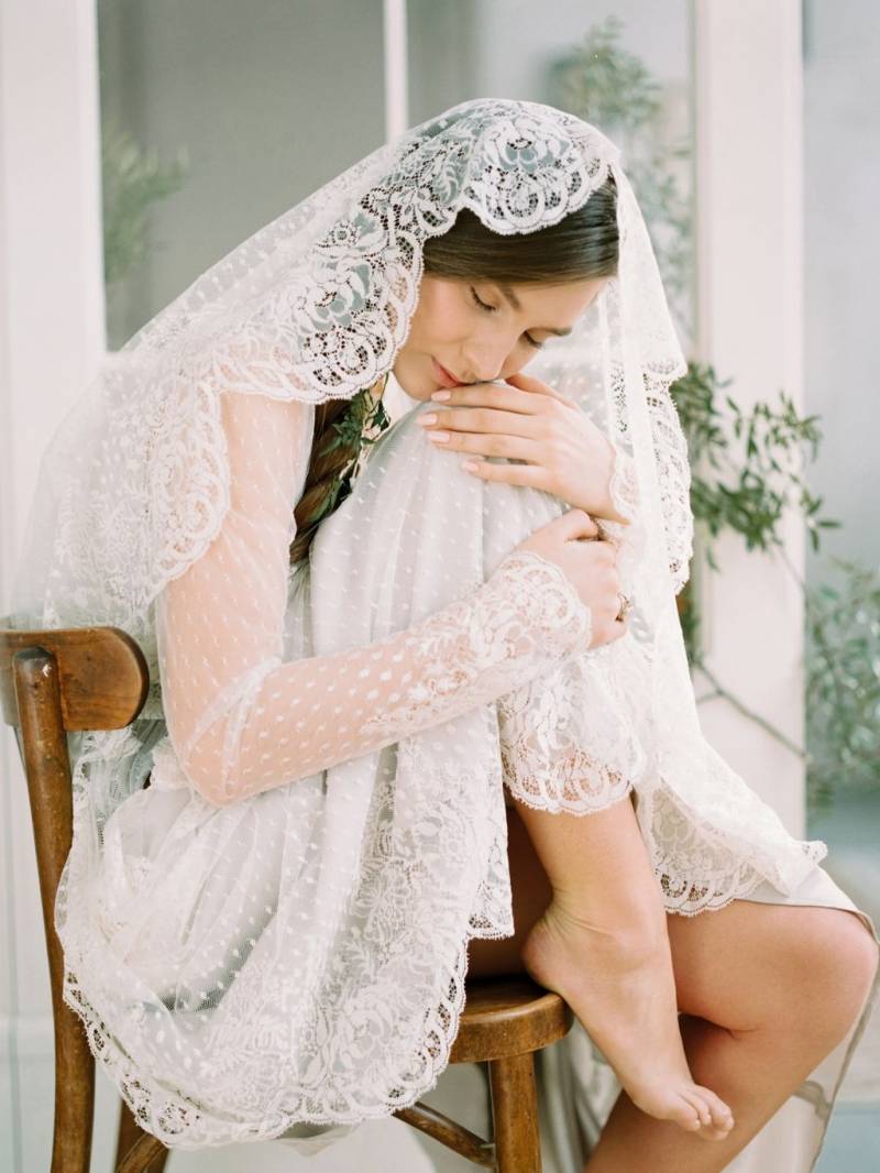Bride wrapped in veil