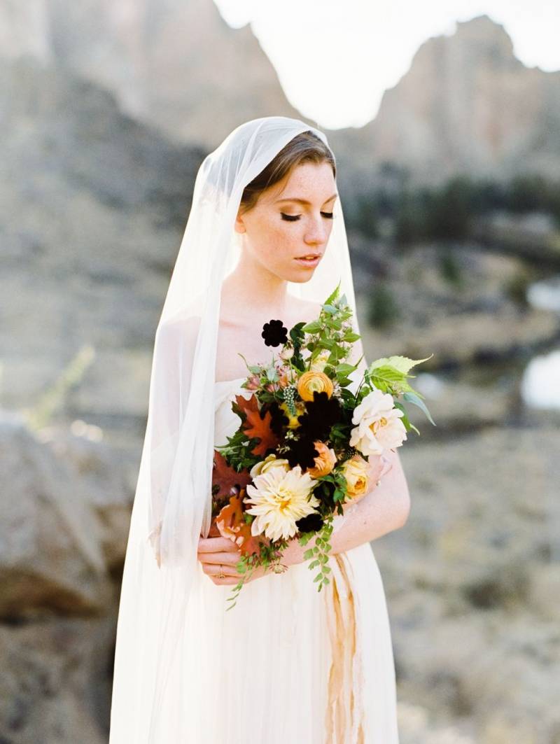 Veiled bride with bouquet