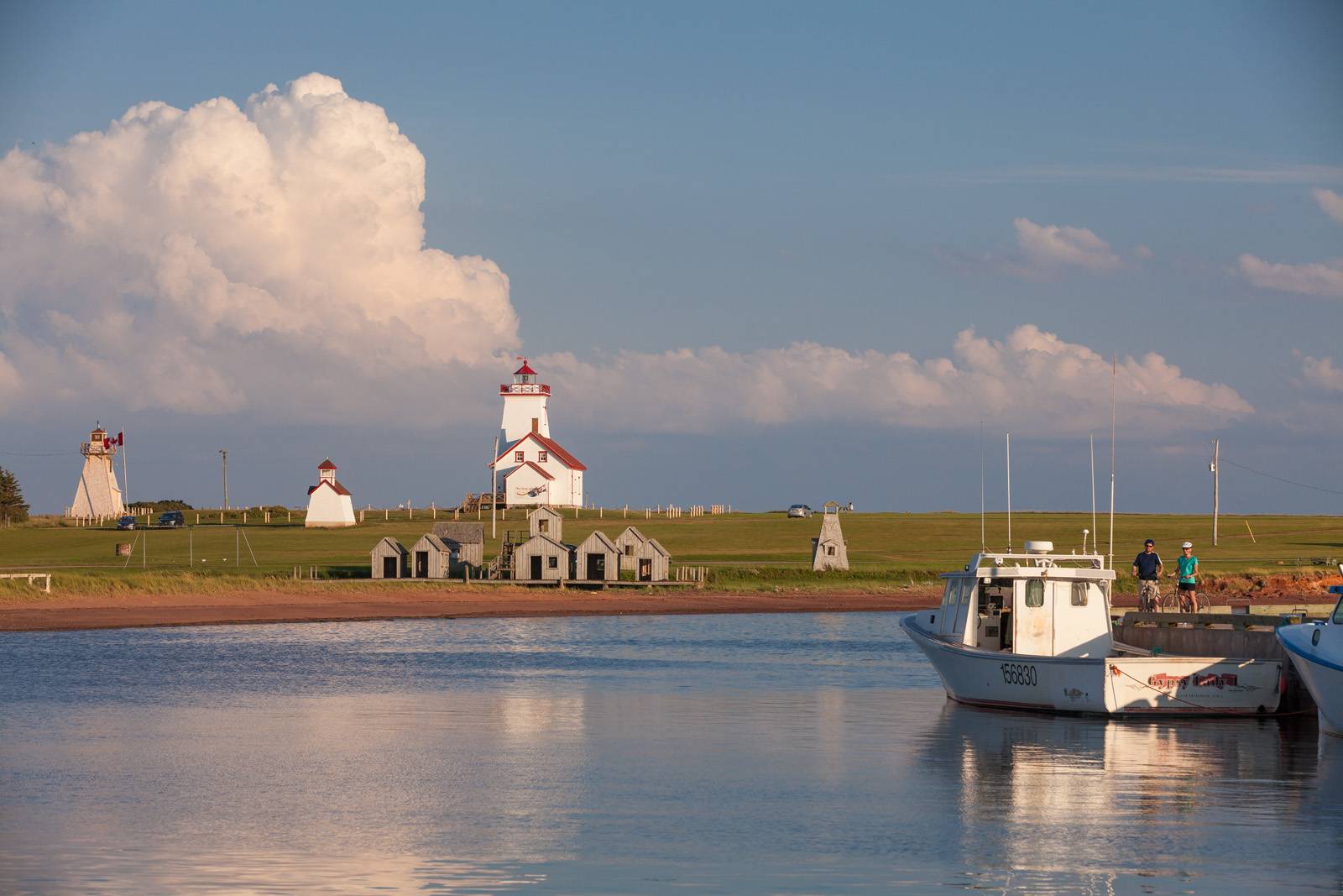 Lighthouse, fishing cabins and fishing boat at Wood Islands