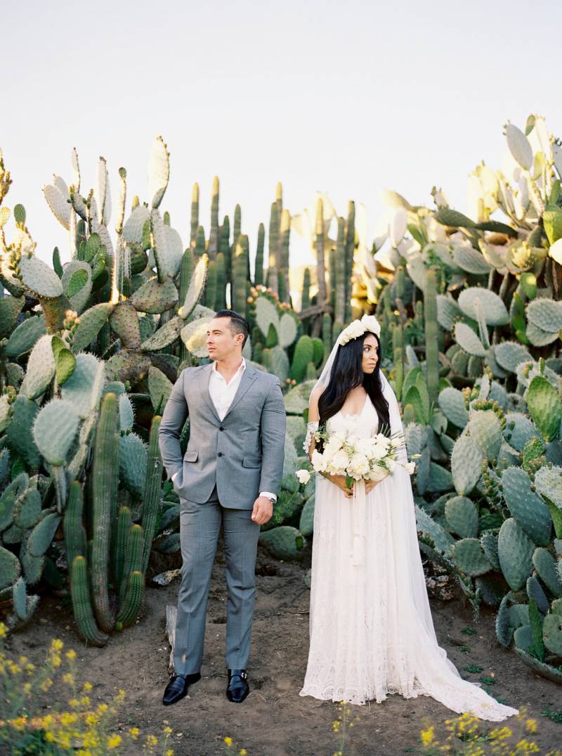 The Couple is Posing in the Cactus Garden | The Wedding Standard
