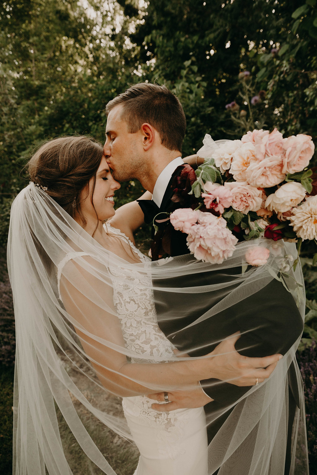 Groom Kissing her Bride on Forehead