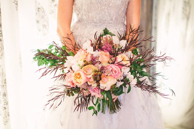Bride with a lovely Bouquet | The Wedding Standard