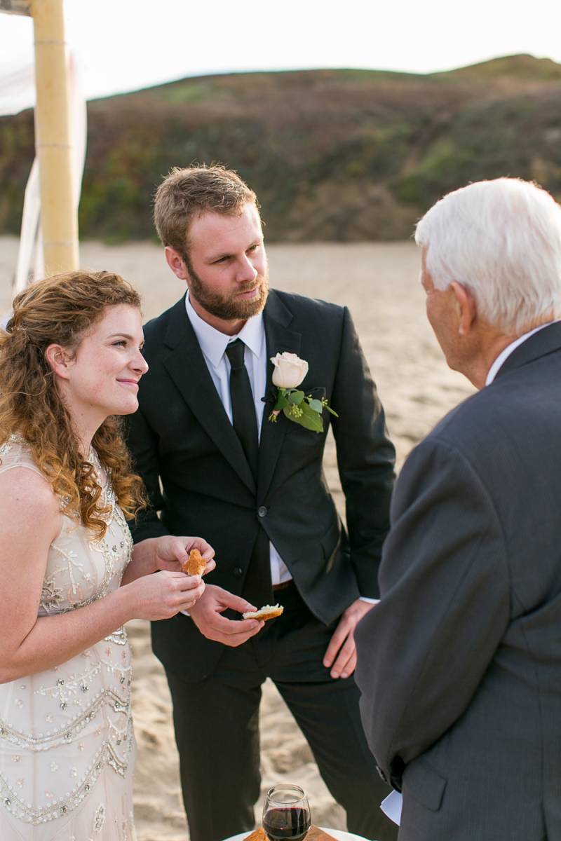 Bride and Groom Communicating with an Old Man