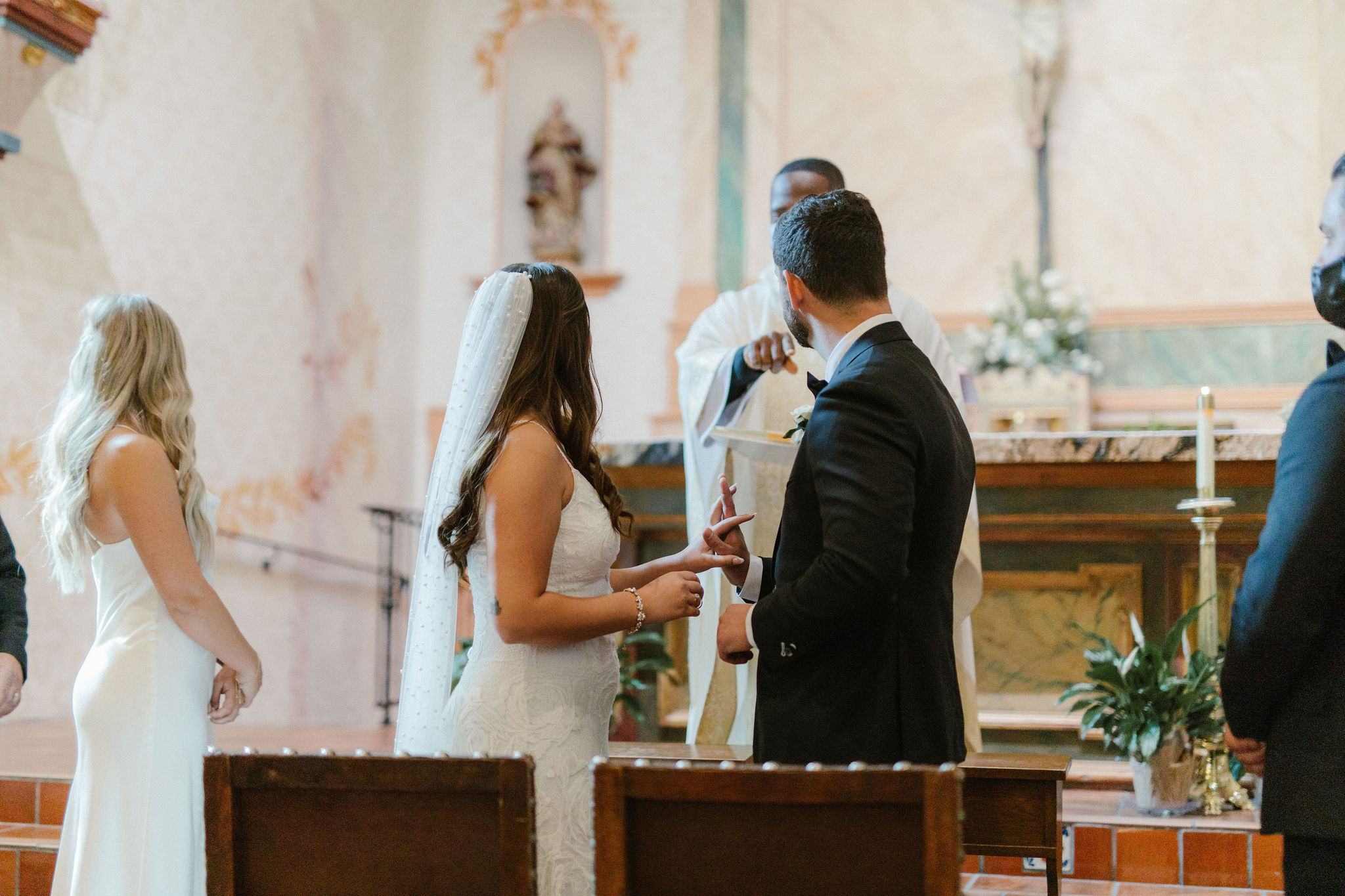 altar, church, holding hands, veil, dress, groom, suit, bride