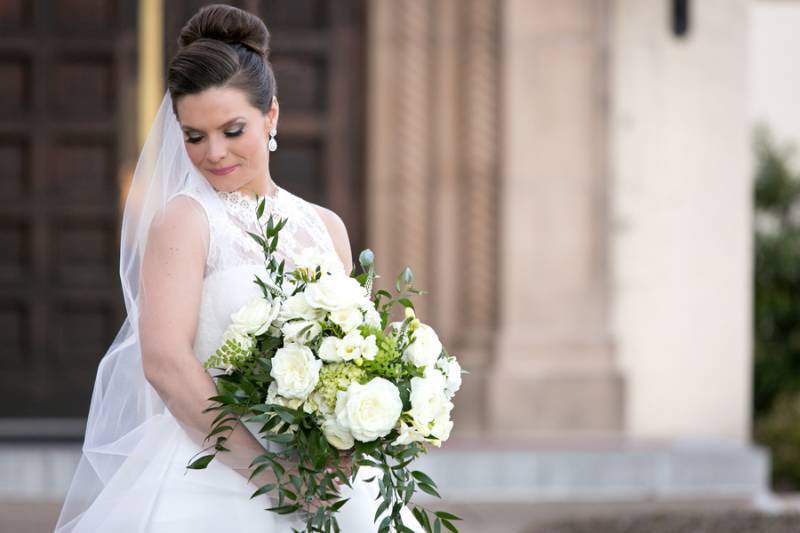 Beautiful bride with white and green bouquet