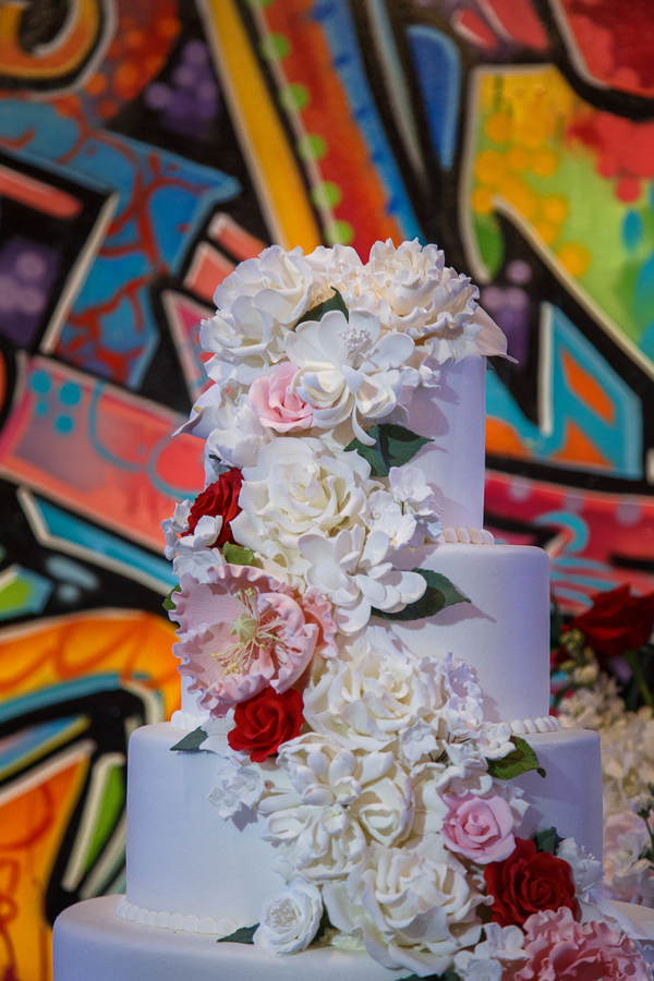White wedding cake with edible flowers